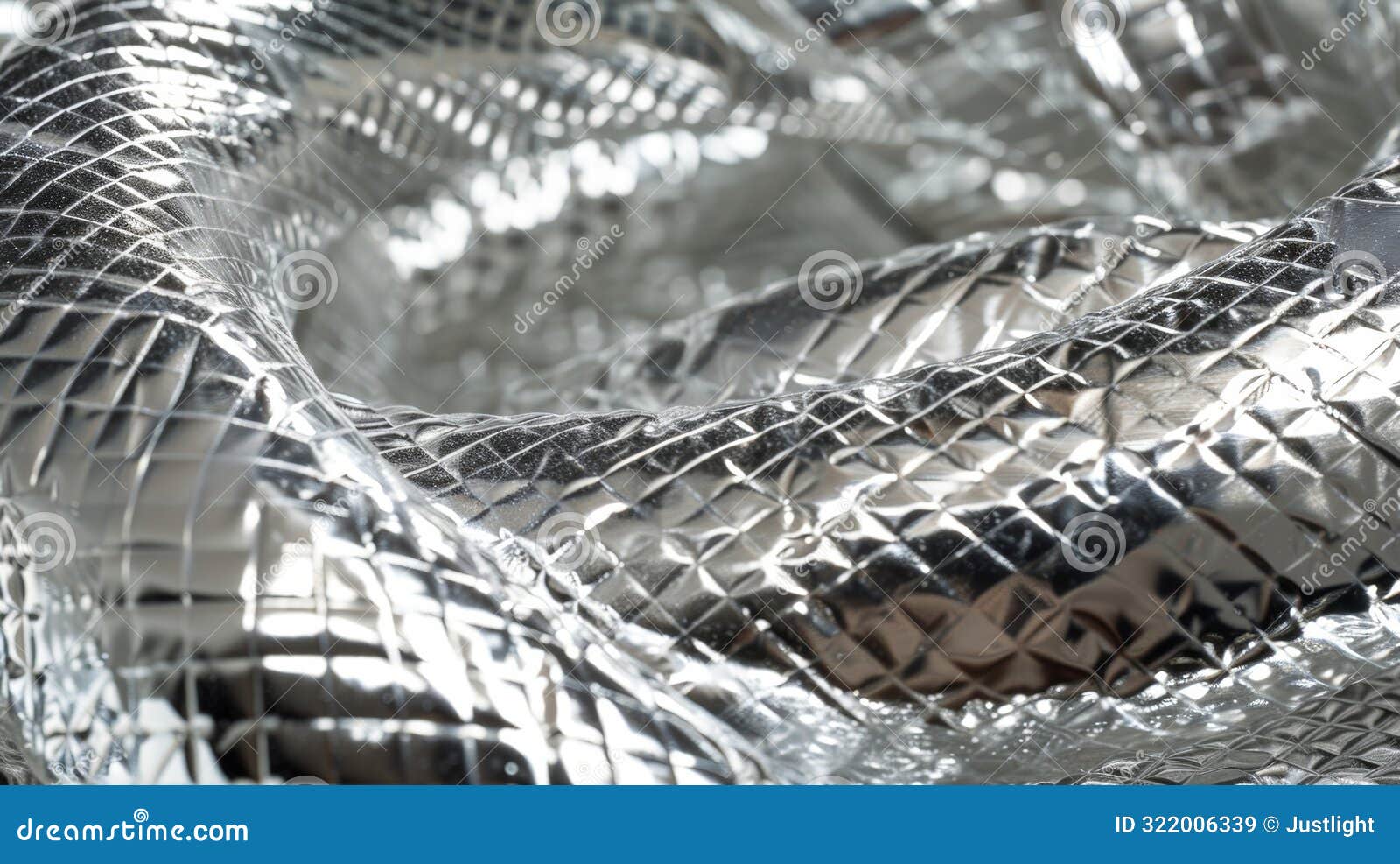 a cled strip of silver insulation covered in a pattern of small indentations and ridges wrapped tightly around a curved
