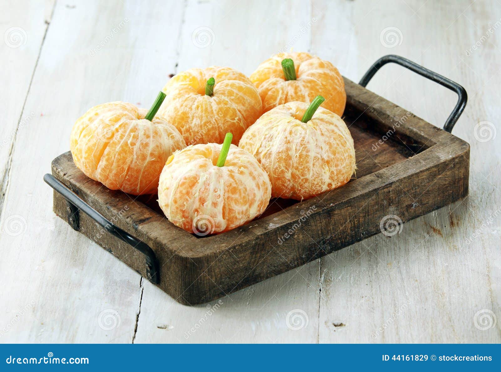 clementine oranges decorated like pumpkins