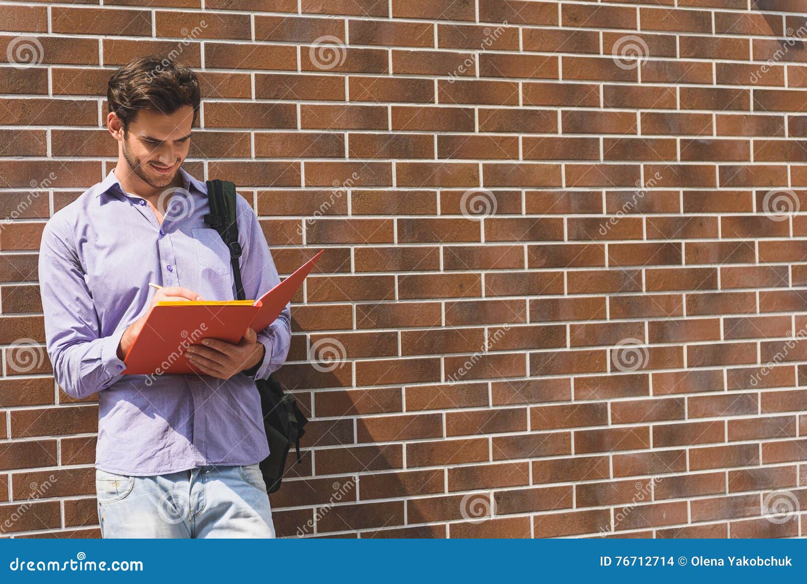 Clever Male Student Making Notes Stock Photo - Image of preparation, rucksack: 76712714