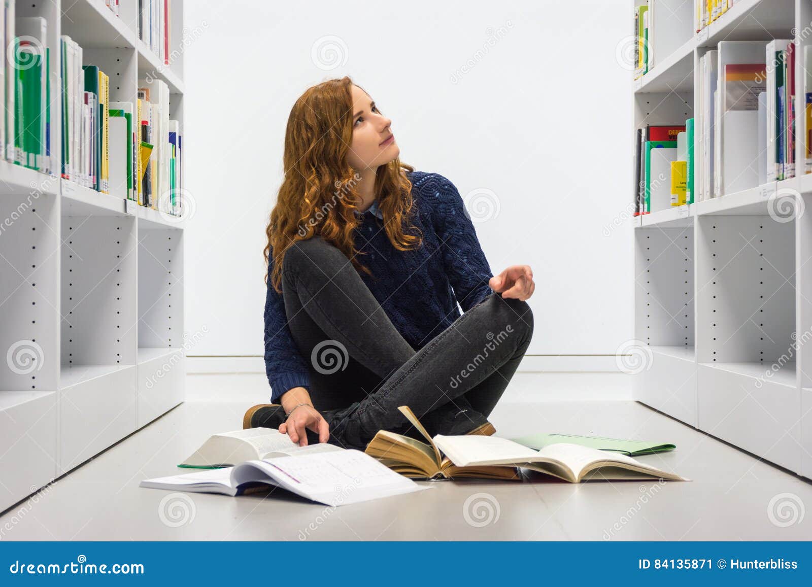 Clever University Student Studying In White Modern Library Books