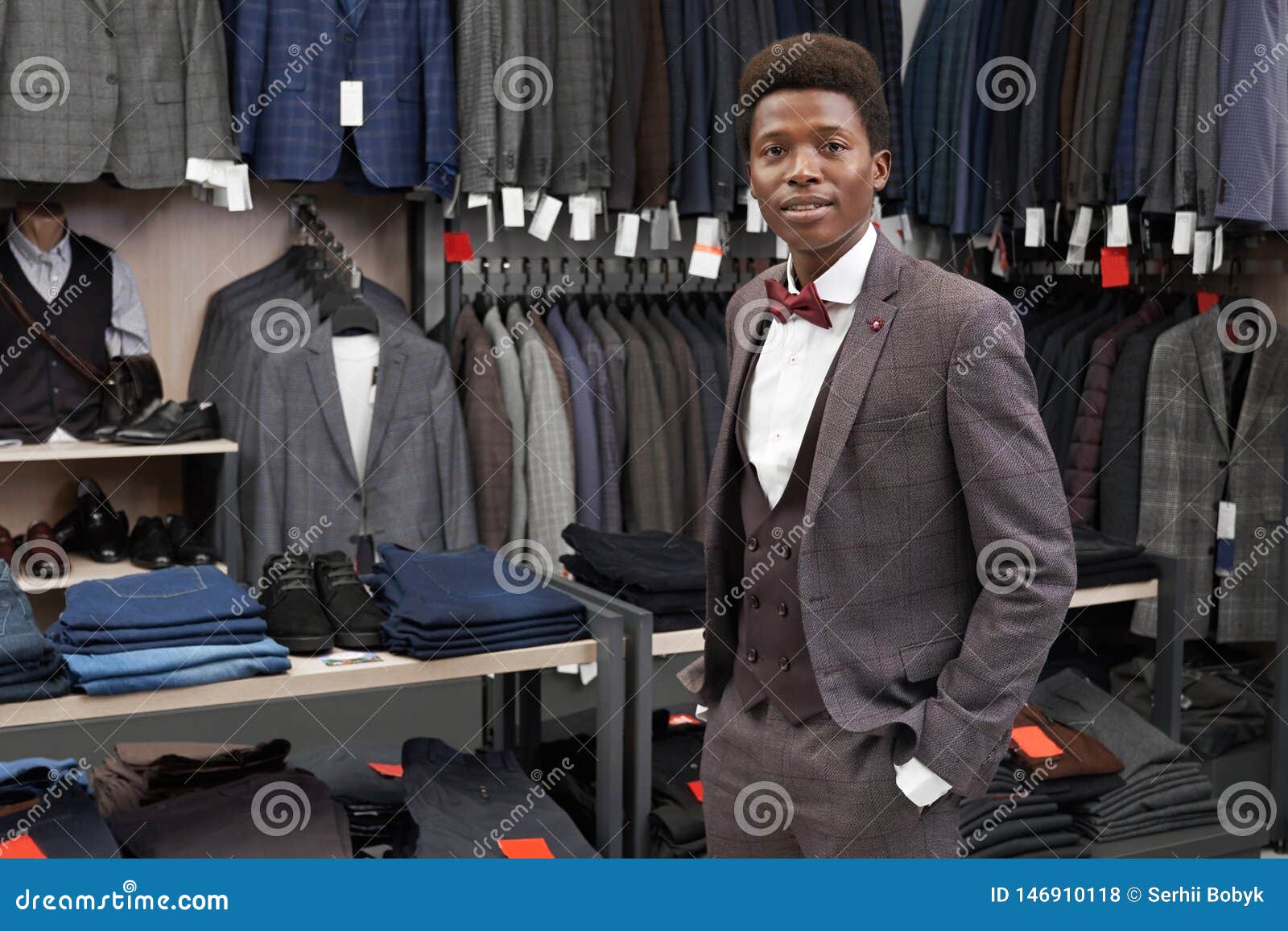 Client Holding Hand in Pocket of Pants Posing in Shop. Stock Photo ...
