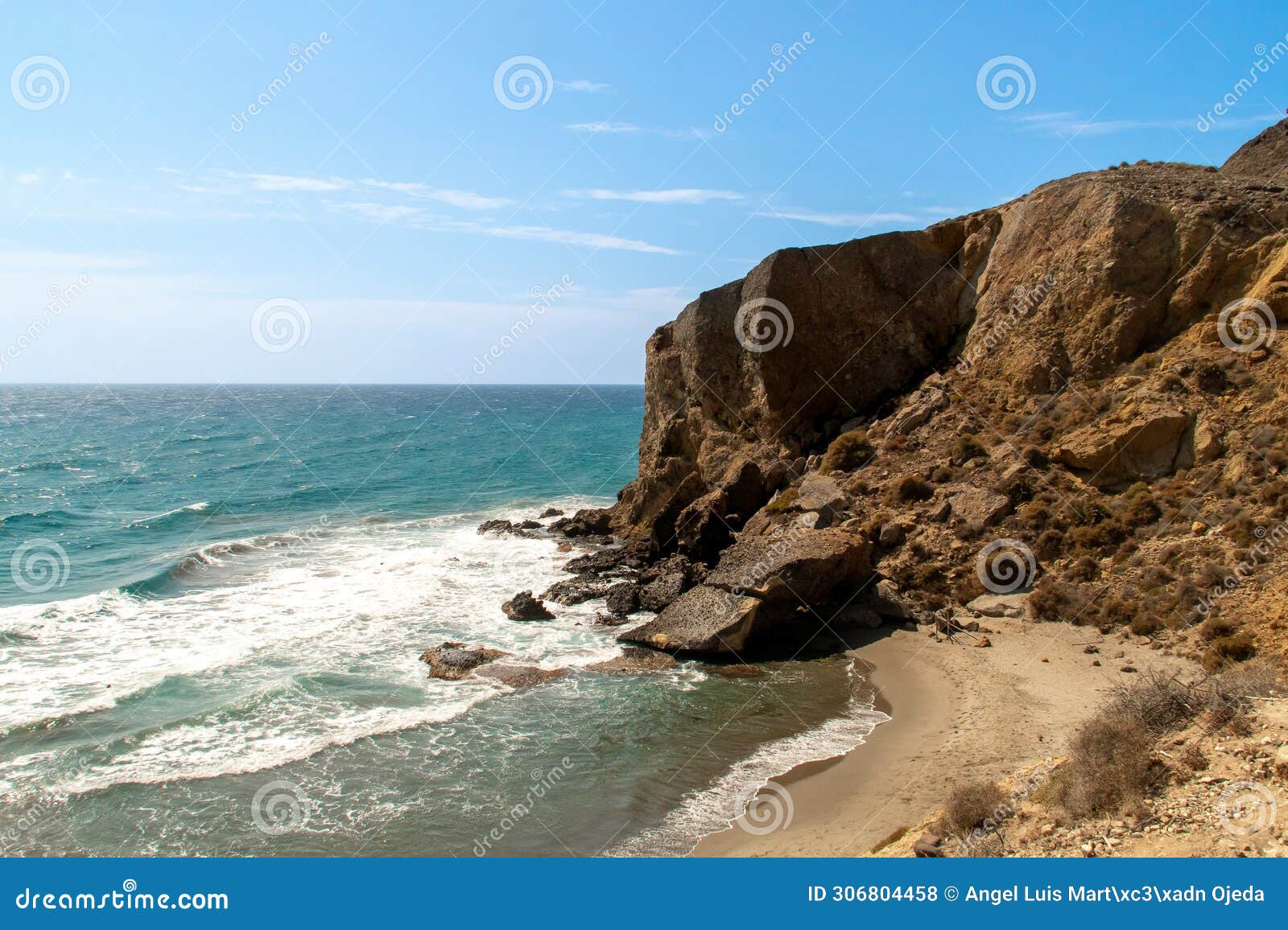 cliffs next to los amarillos cove in the mediterranean sea.