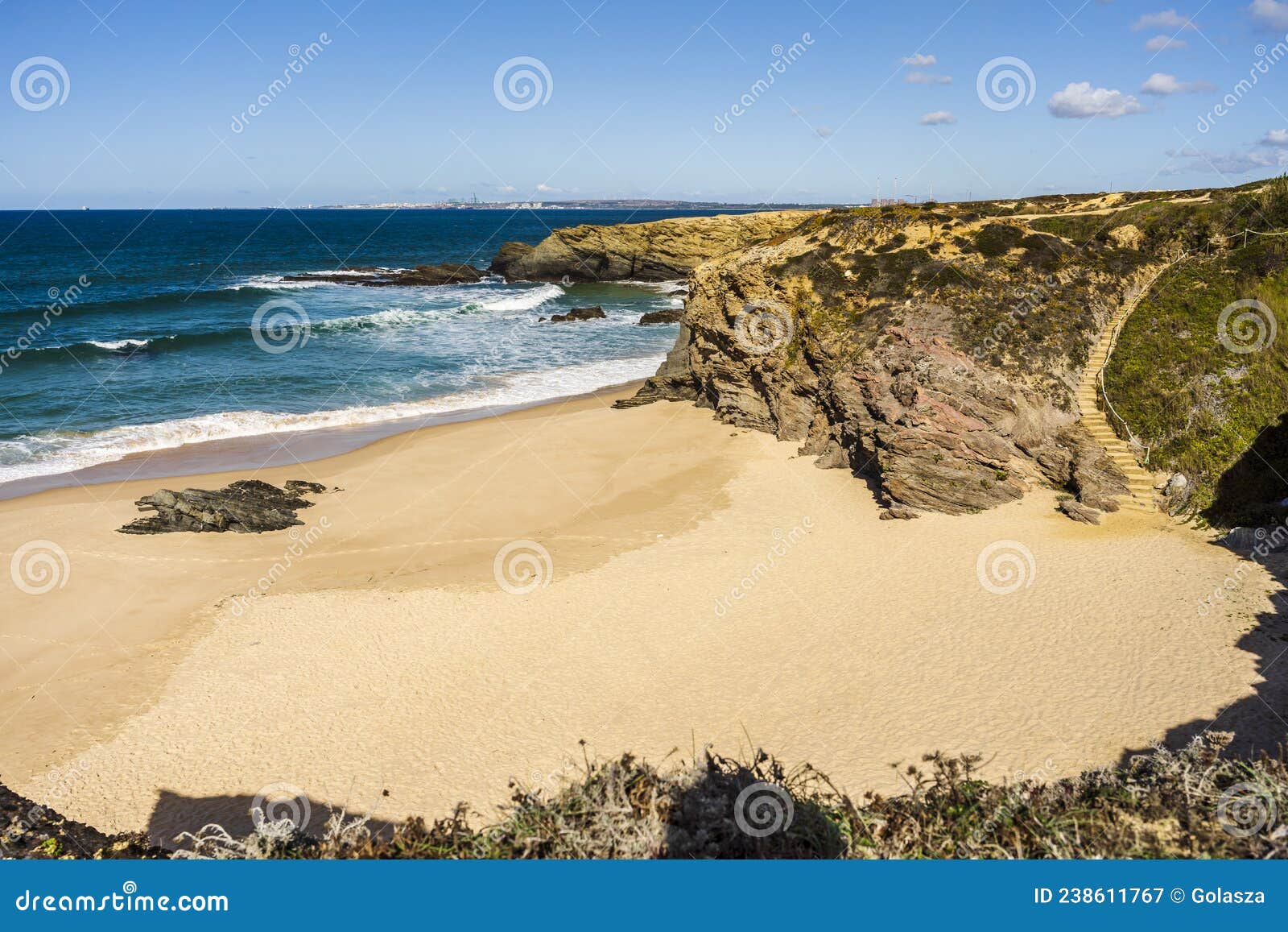 cliffs and sand on cerca nova beach, alentejo, portugal