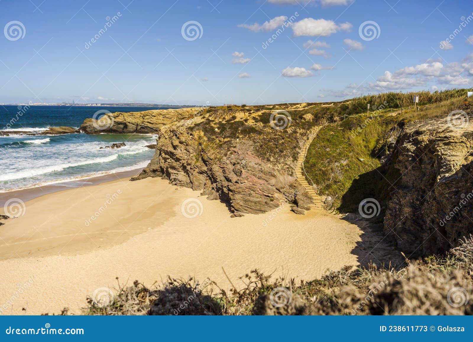 cliffs and sand on cerca nova beach, alentejo, portugal