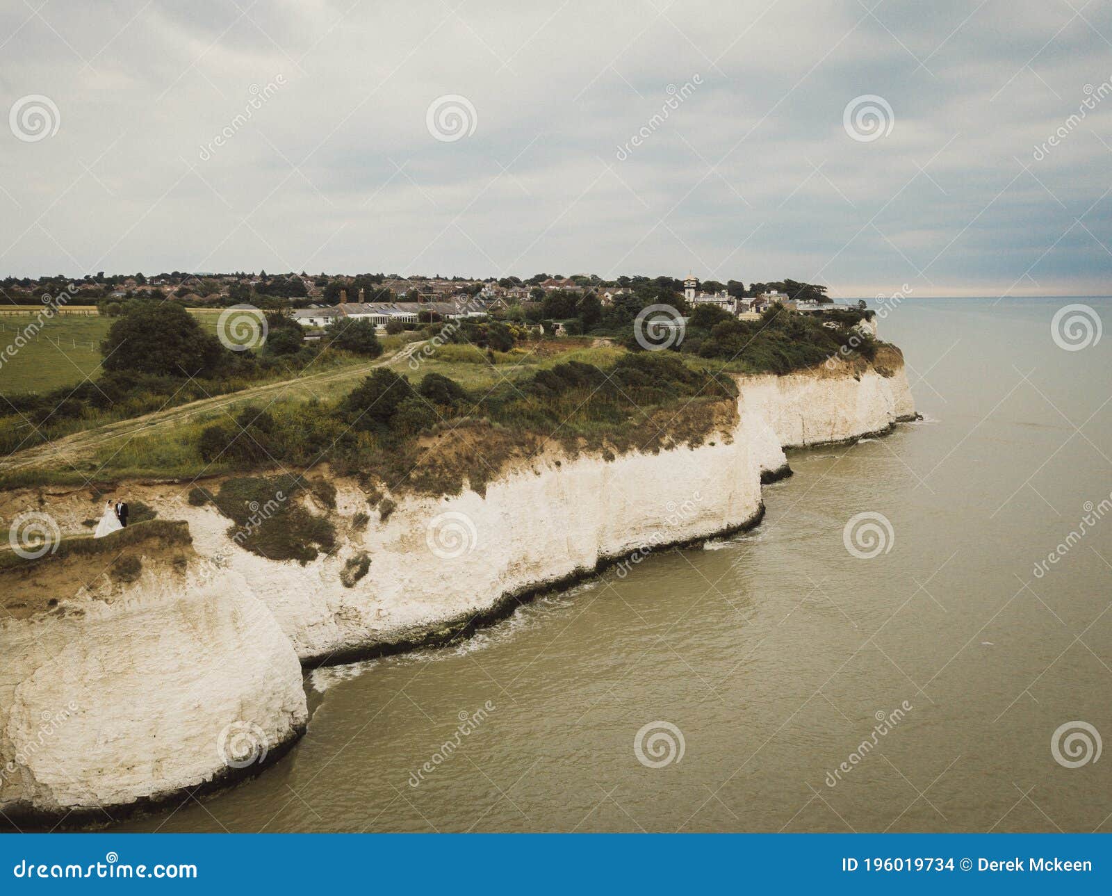 clifftop view of the bride & groom taken from above