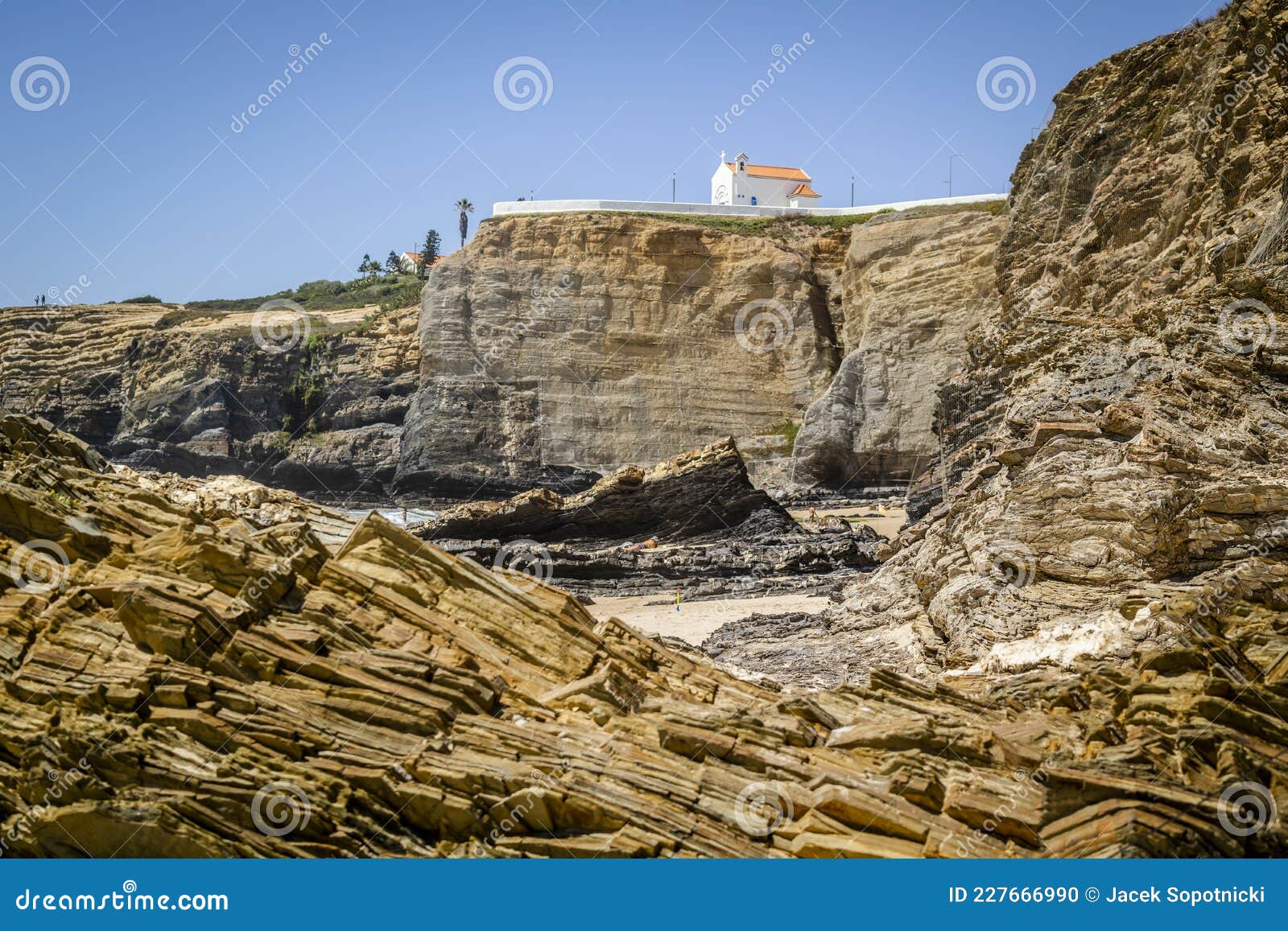 cliffy beach in zambujeira do mar, vincentina coast natural park, alentejo, portugal