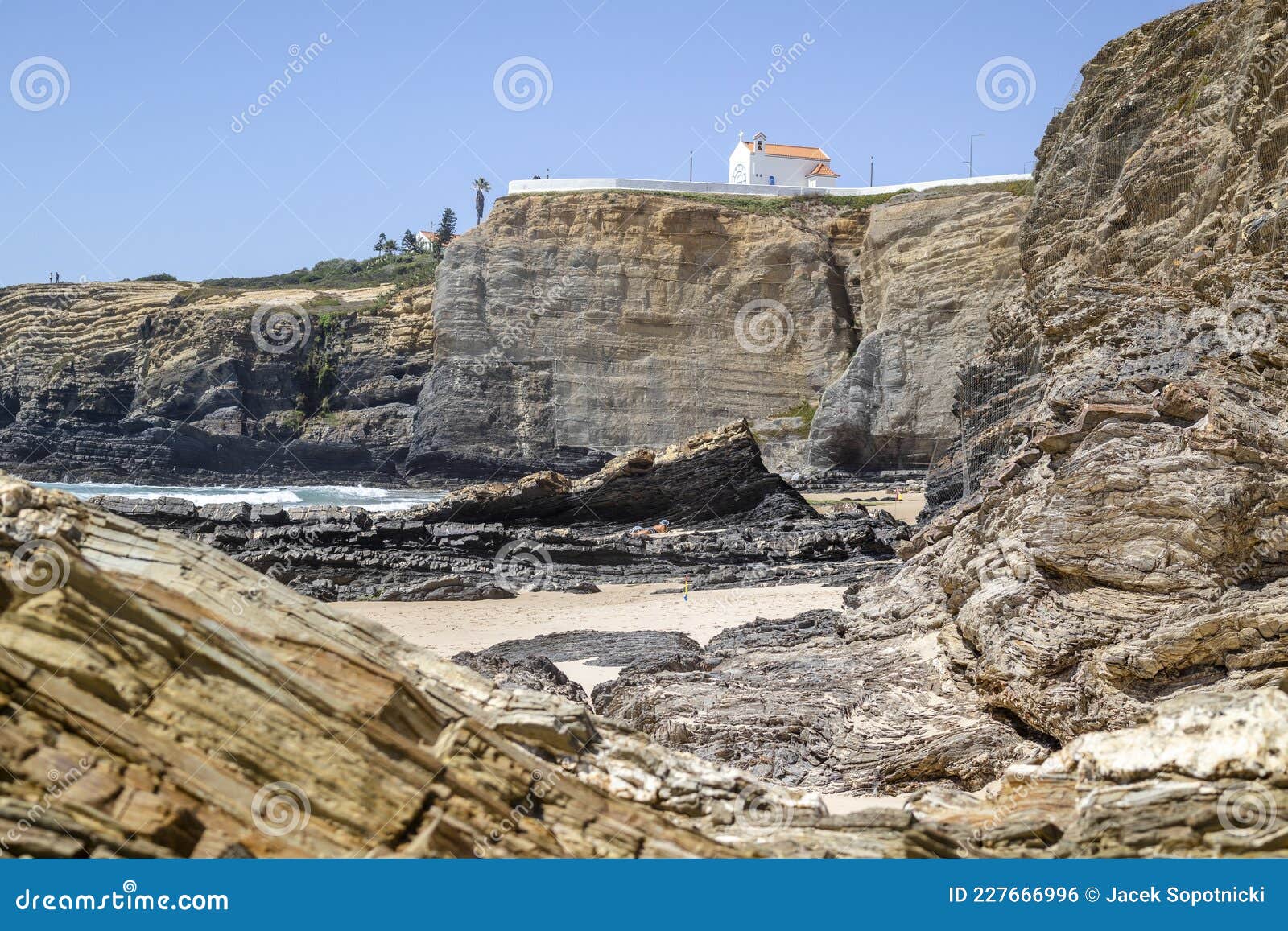 cliffy beach in zambujeira do mar, vincentina coast natural park, alentejo, portugal