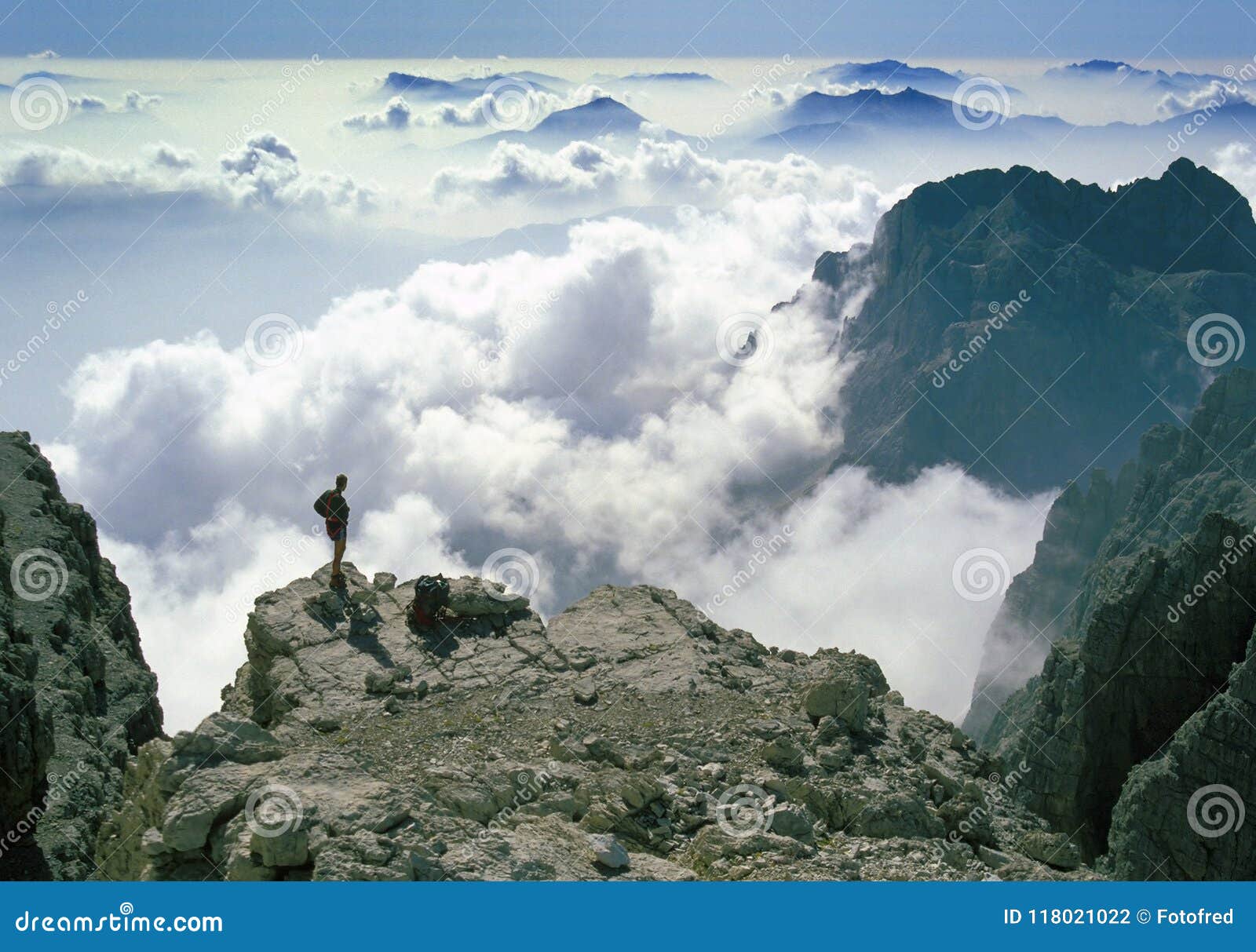climber admiring breathtaking mountain panorama