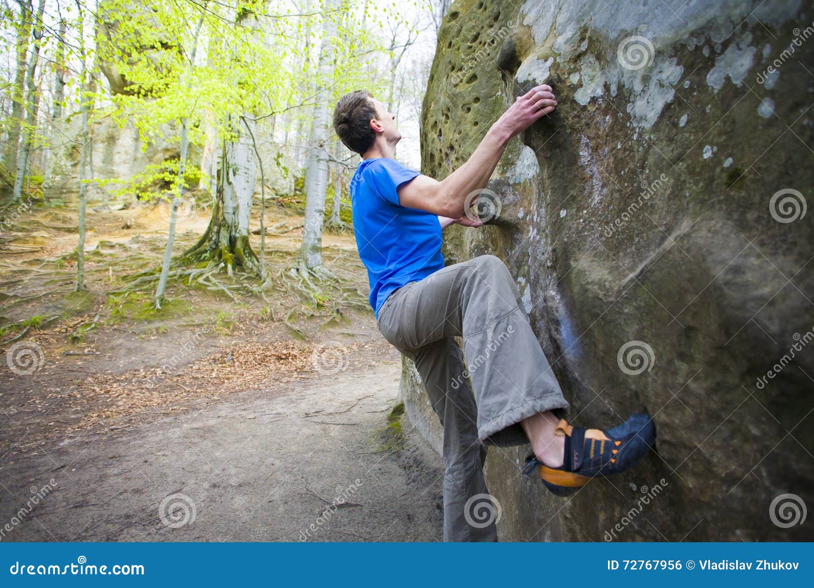 Climber is Bouldering on the Rocks. Stock Photo Image of challenge