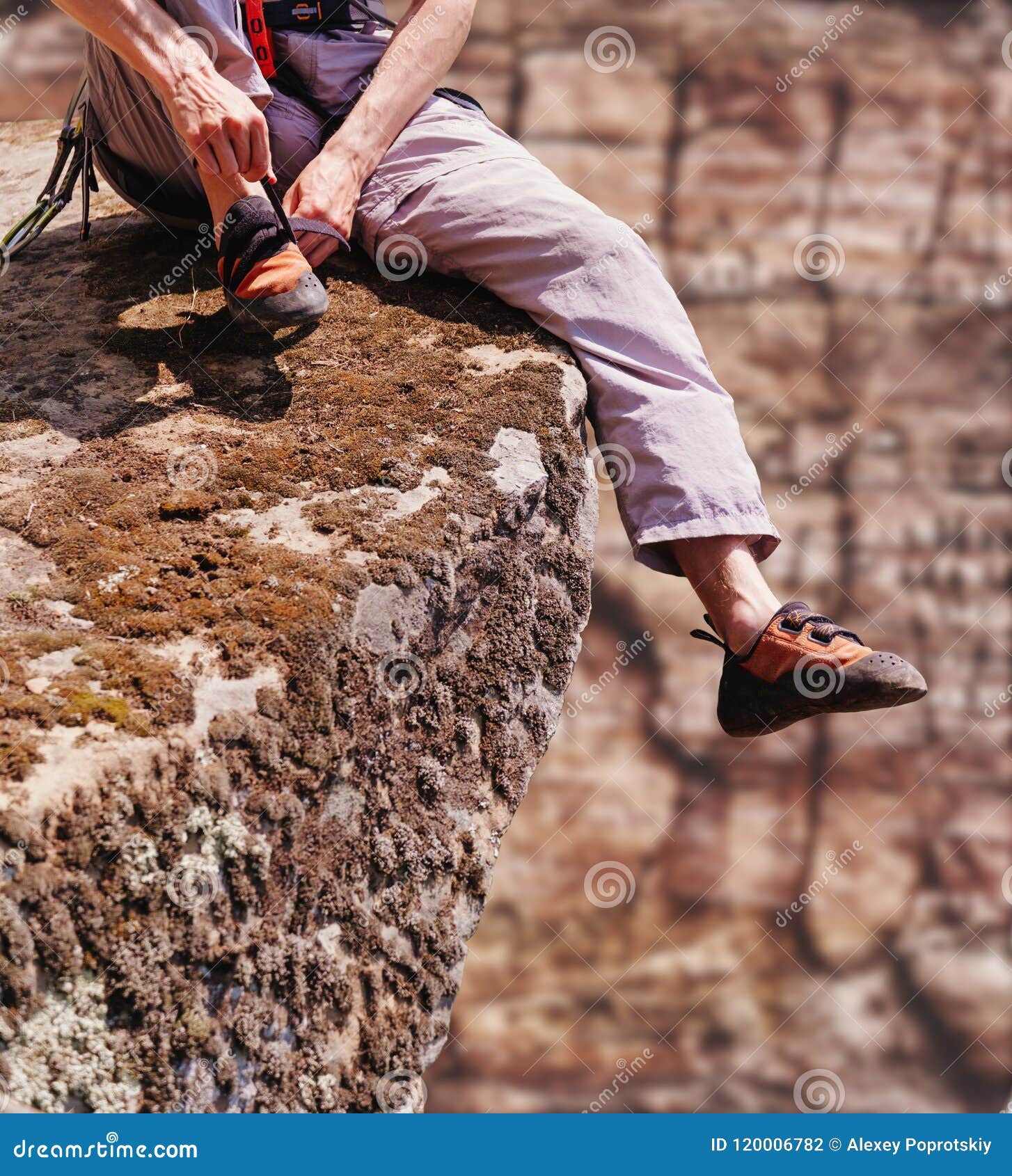 Climber Man Putting on Shoes Outdoor. Stock Photo - Image of wall, harness:  120006782
