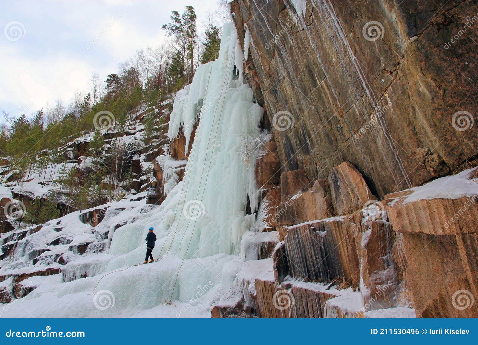 Climber Training on a Frozen Waterfall. Stolby Nature Reserve