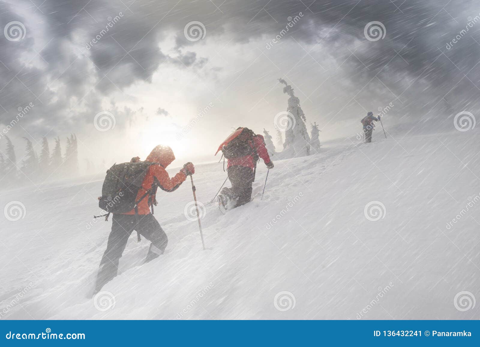 climbers in mountain snowfall
