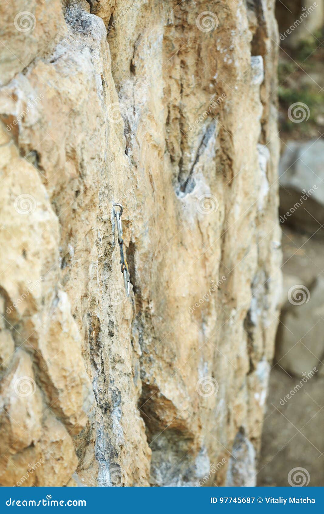 Climbing Quickdraw Fixed on Jumper on the Cliff. Climbing Equipment