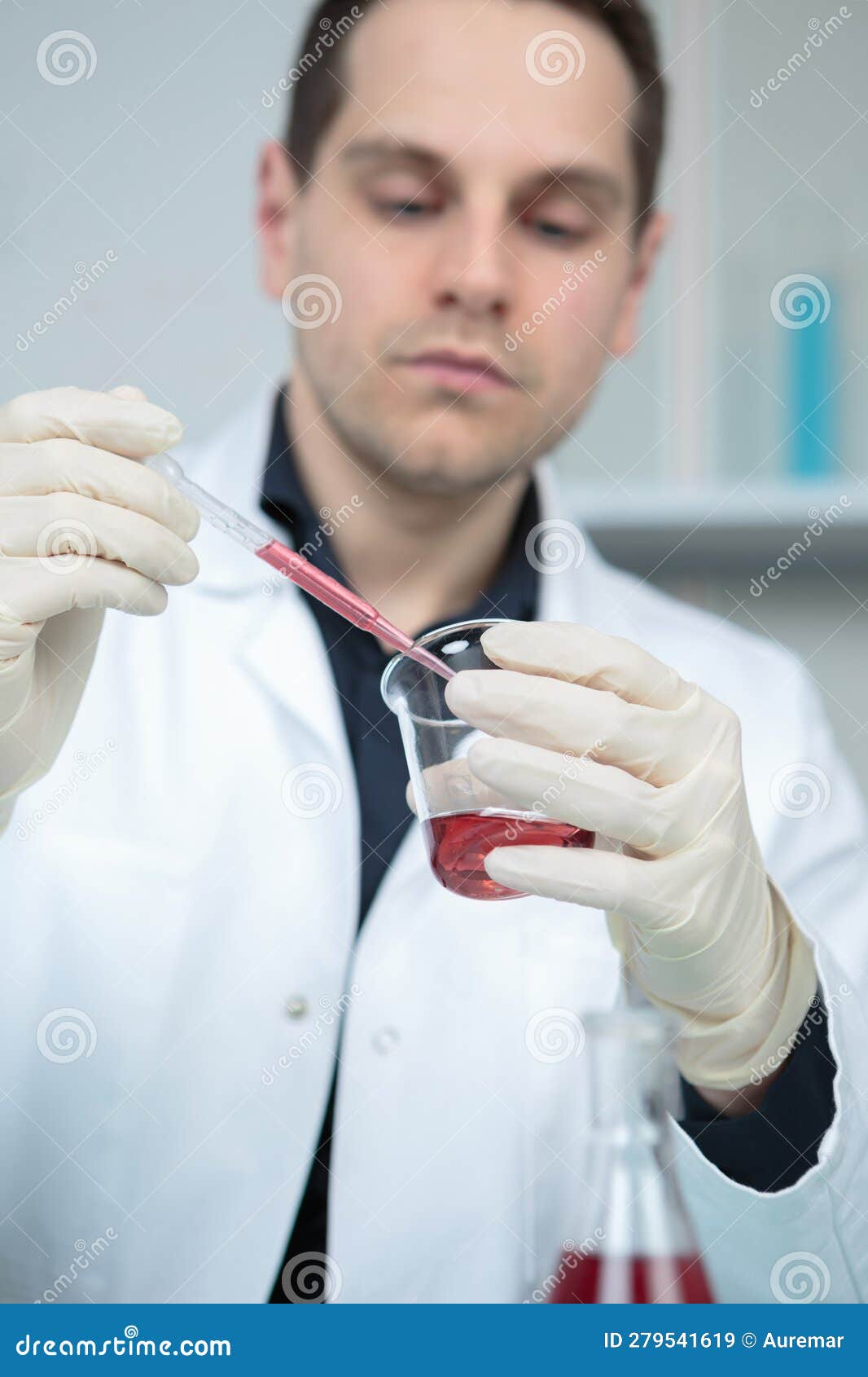 Clinician Holding Tools during Scientific Experiment in Laboratory