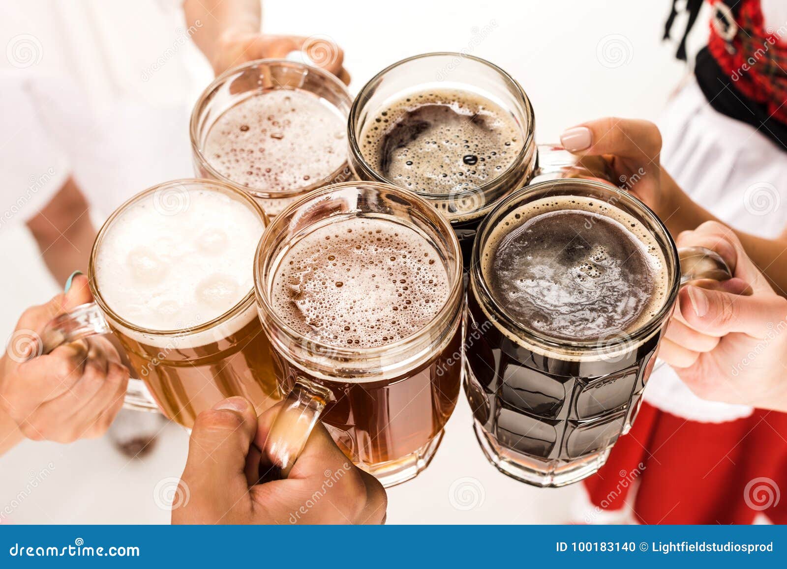 Clinking with beer glasses stock photo. Image of drink 100183140