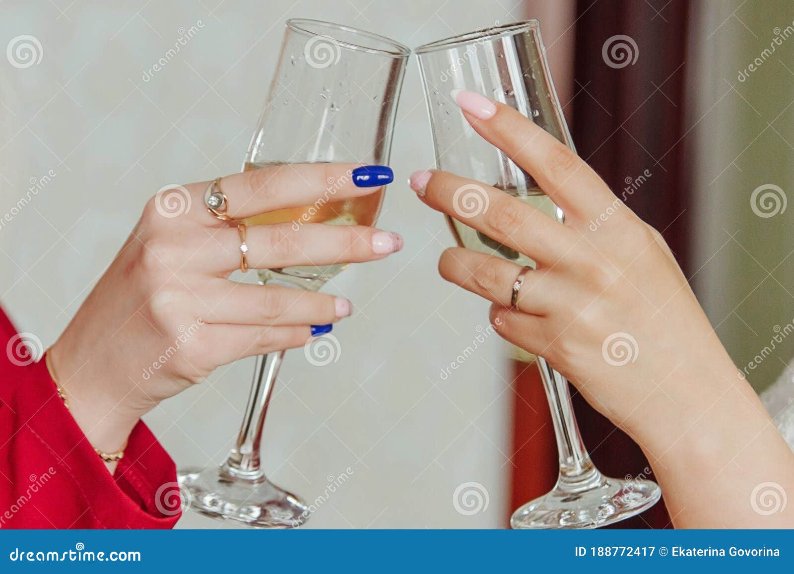 Clinking Glasses Of Champagne In Hands Of Two Women Stock Image
