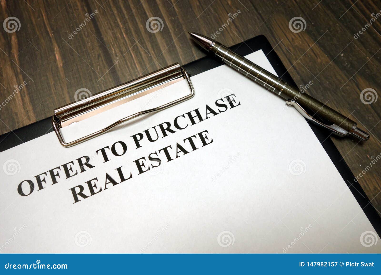 clipboard with offer to purchase real estate mockup and pen on desk