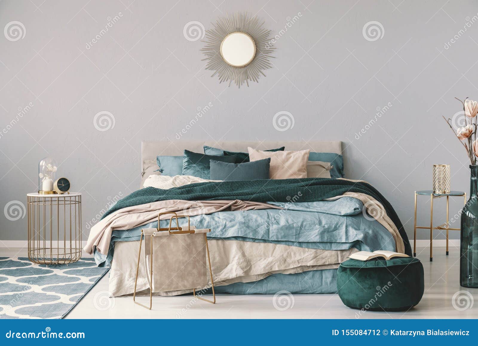 Clock And Flower In Fancy Vase On Nightstand Table Next To