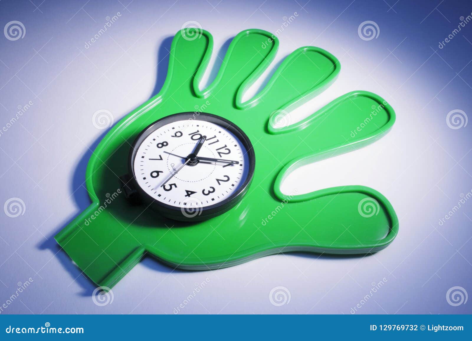 Clock on Plastic Hand stock photo. Image of give, palm 129769732