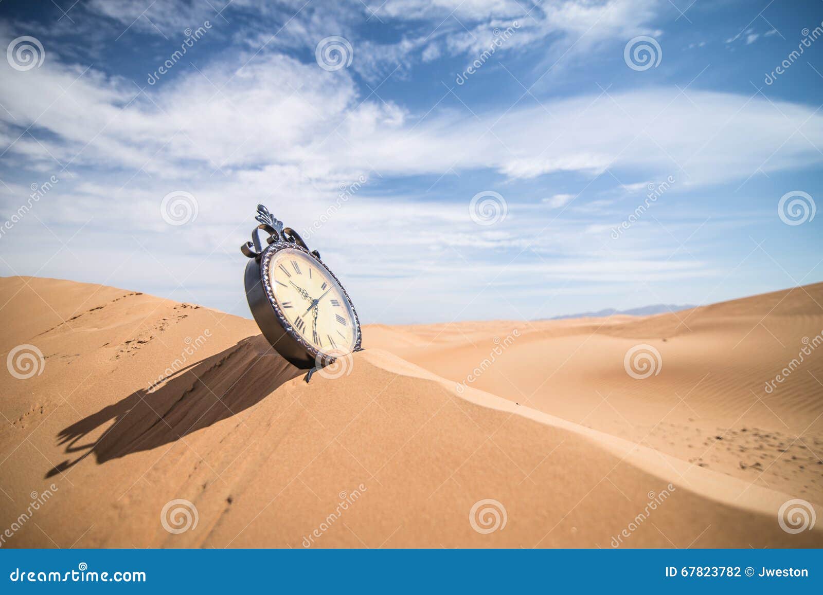 A clock in the sand dunes stock photo. Image of clock 67823782