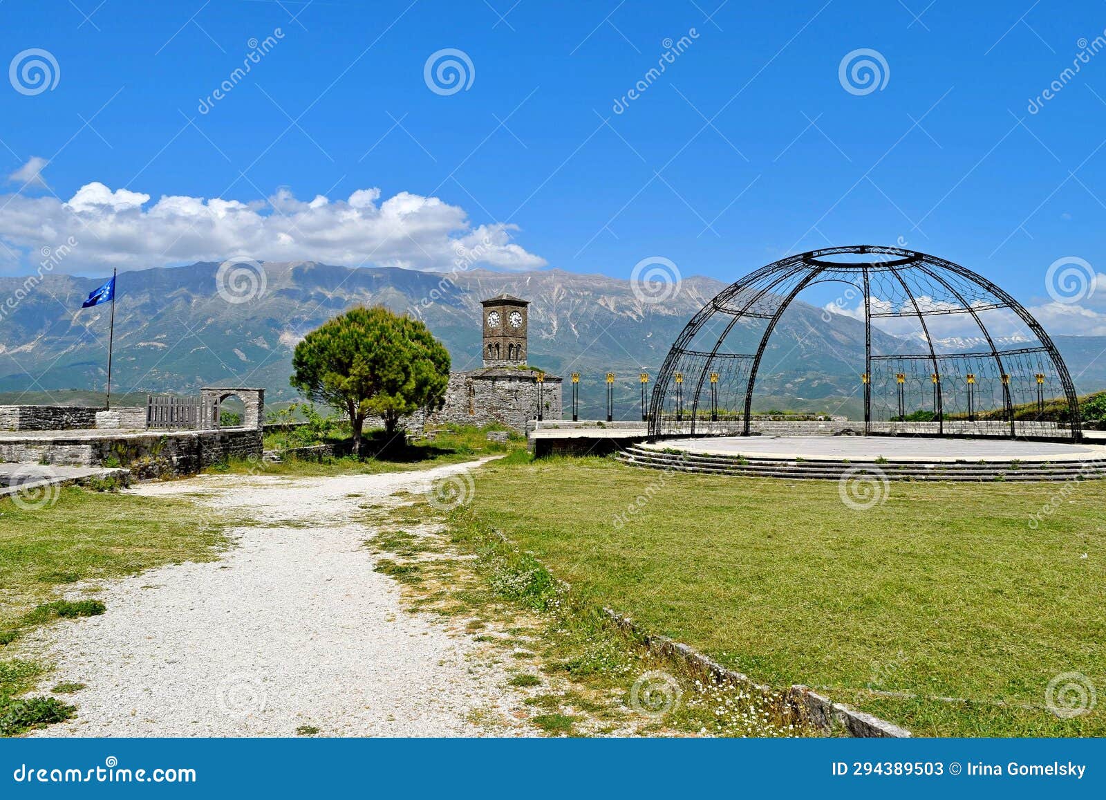 clock tower, openwork dome and eu flag in the ancient fortress of gjirokaster, albania