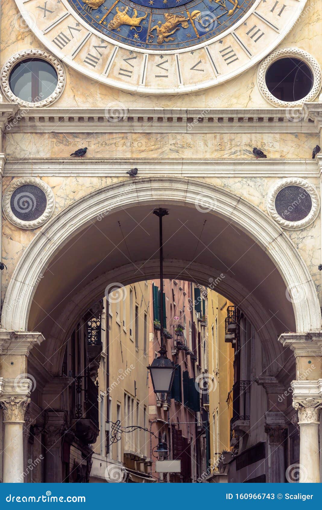 clock tower torre dell`orologio at piazza san marco or st mark`s square, venice, italy. it is old landmark of venice