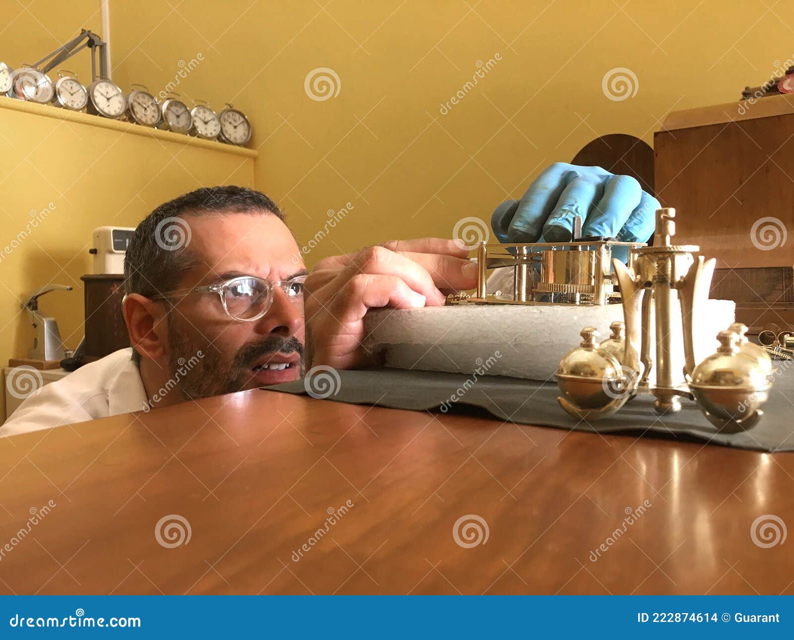 Clockmaker Repairs Clocks and Watches in His Laboratory Stock Photo