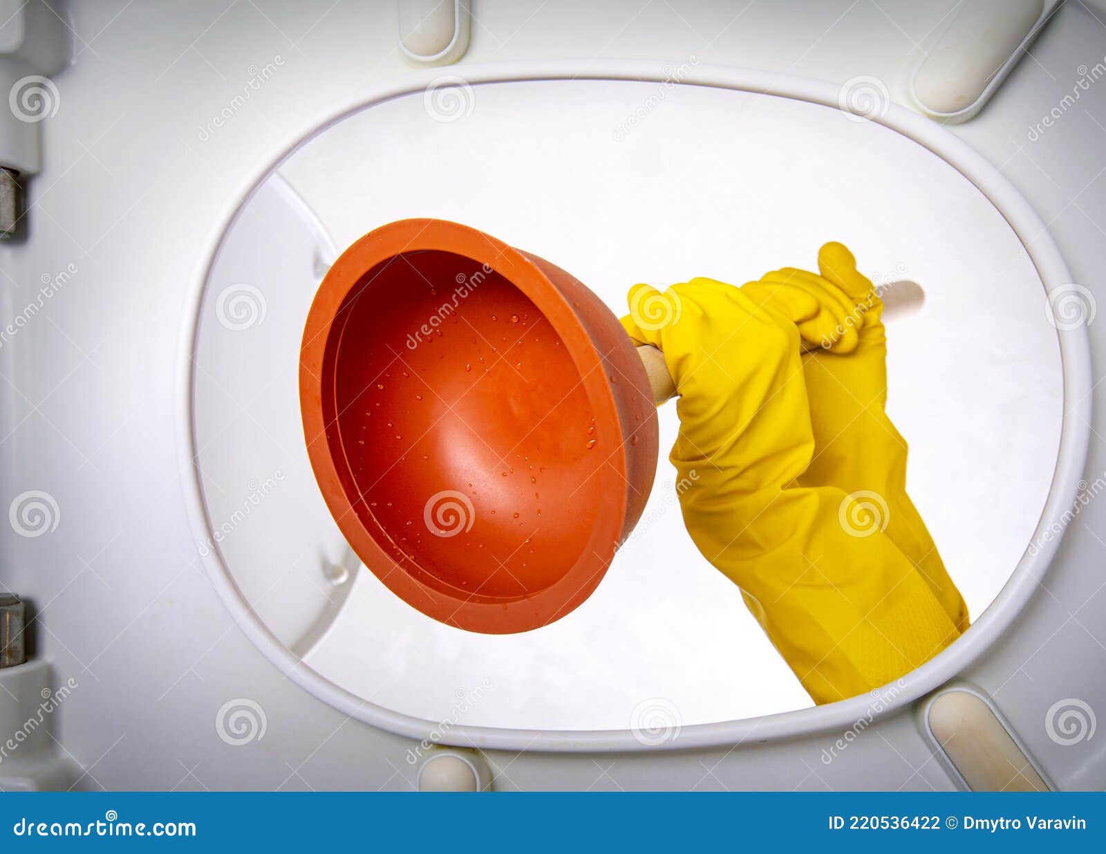 Clogged Sewer. Bathroom Toilet Plunger Suction in a Hands Gets in the