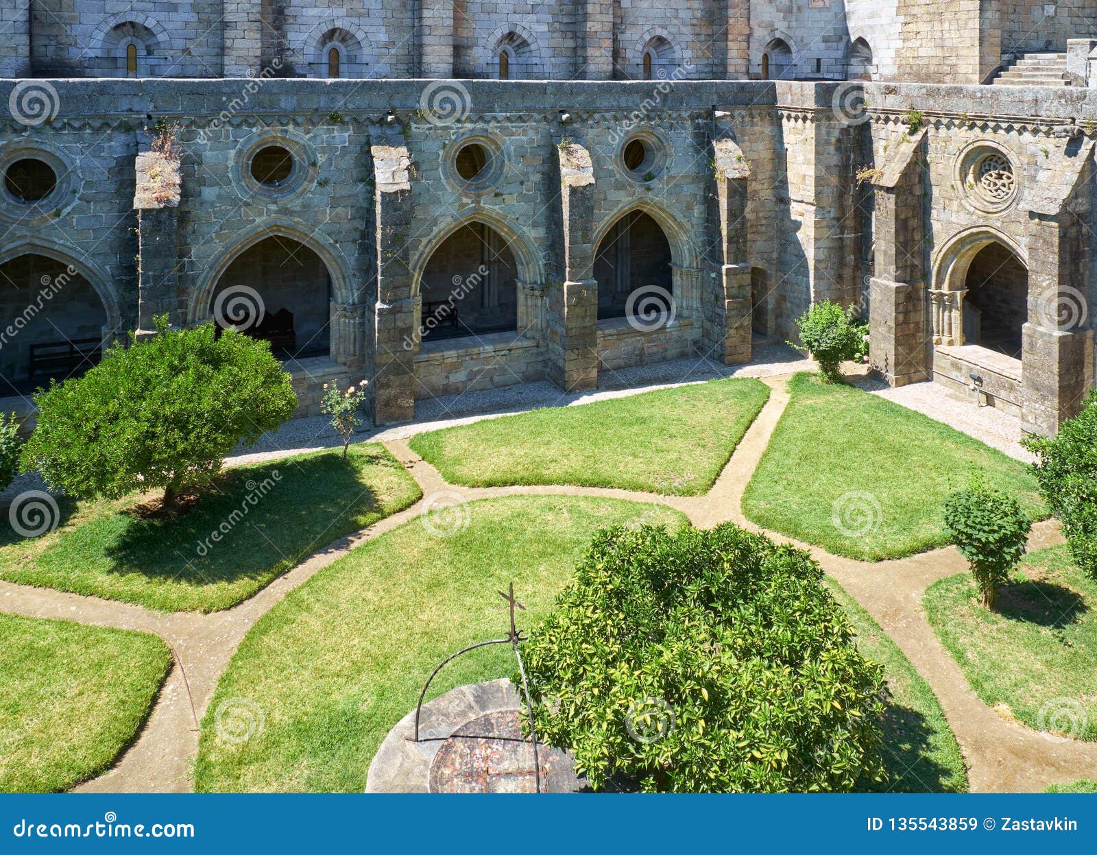 a cloister and the interior courtyard of cathedral (se) of evora. portugal