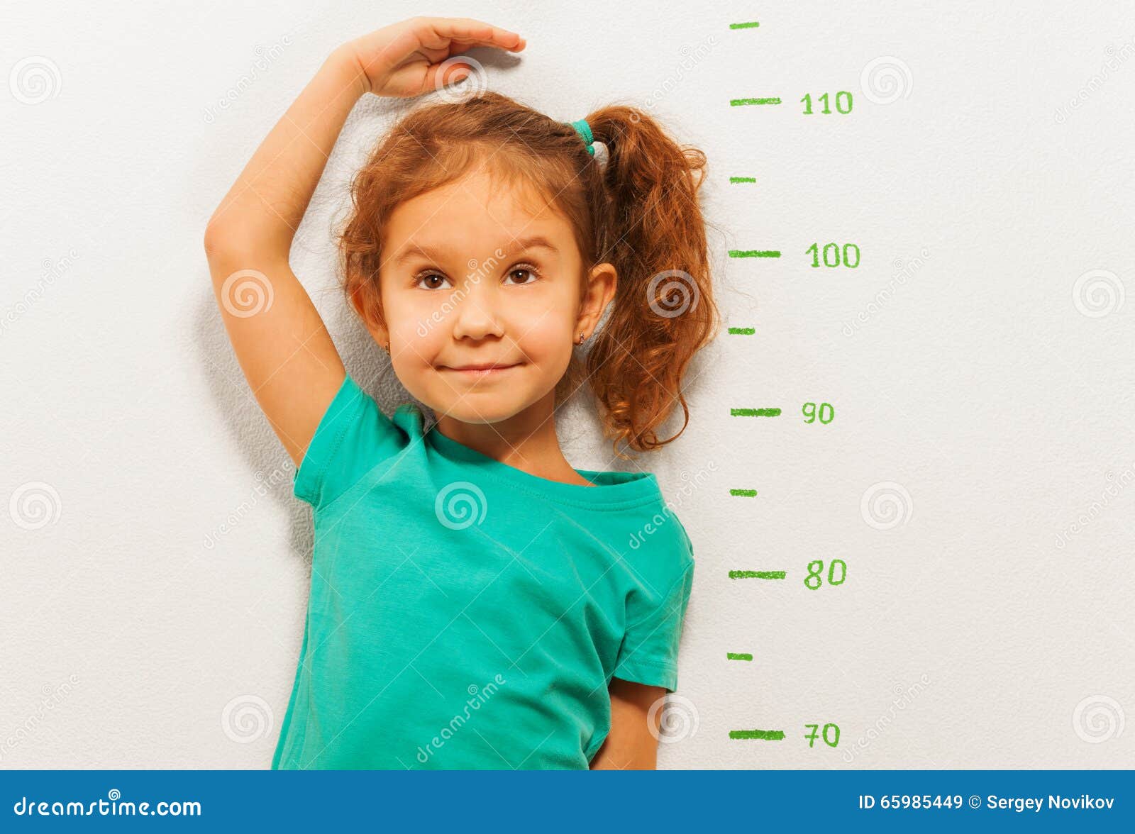 close portrait of a girl show height on wall scale