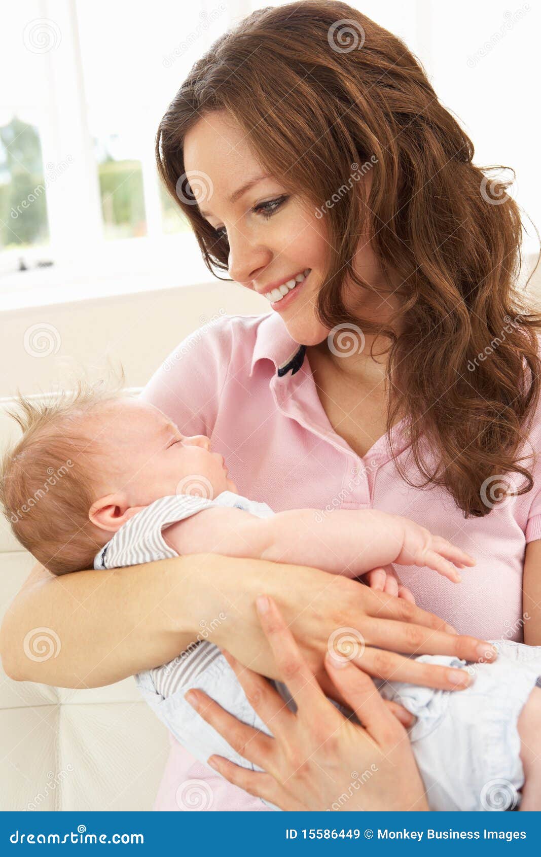 close up of affectionate mother cuddling baby boy