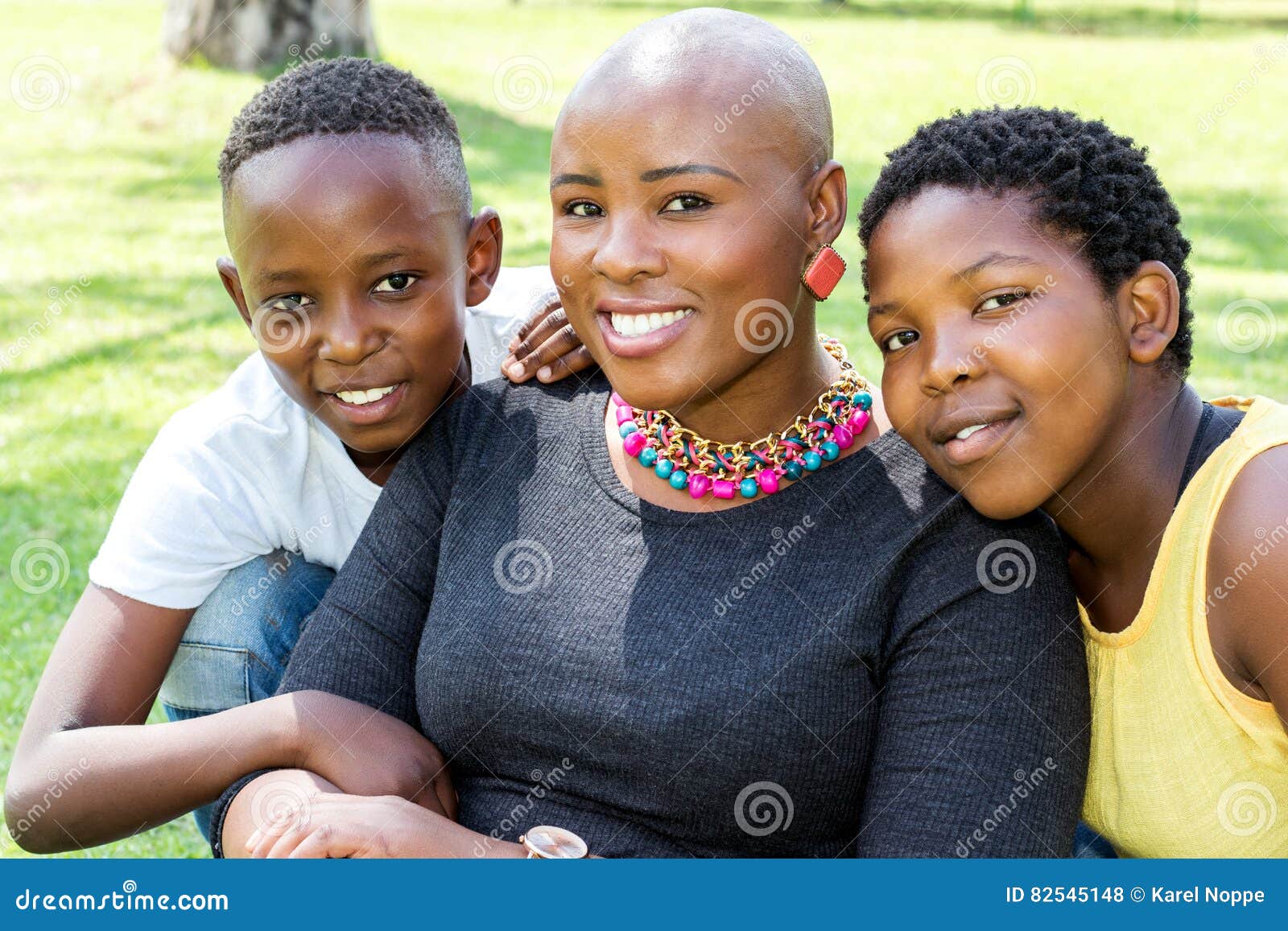 African kids playing on swing in neighborhood. Stock Photo by ©karelnoppe  64619673