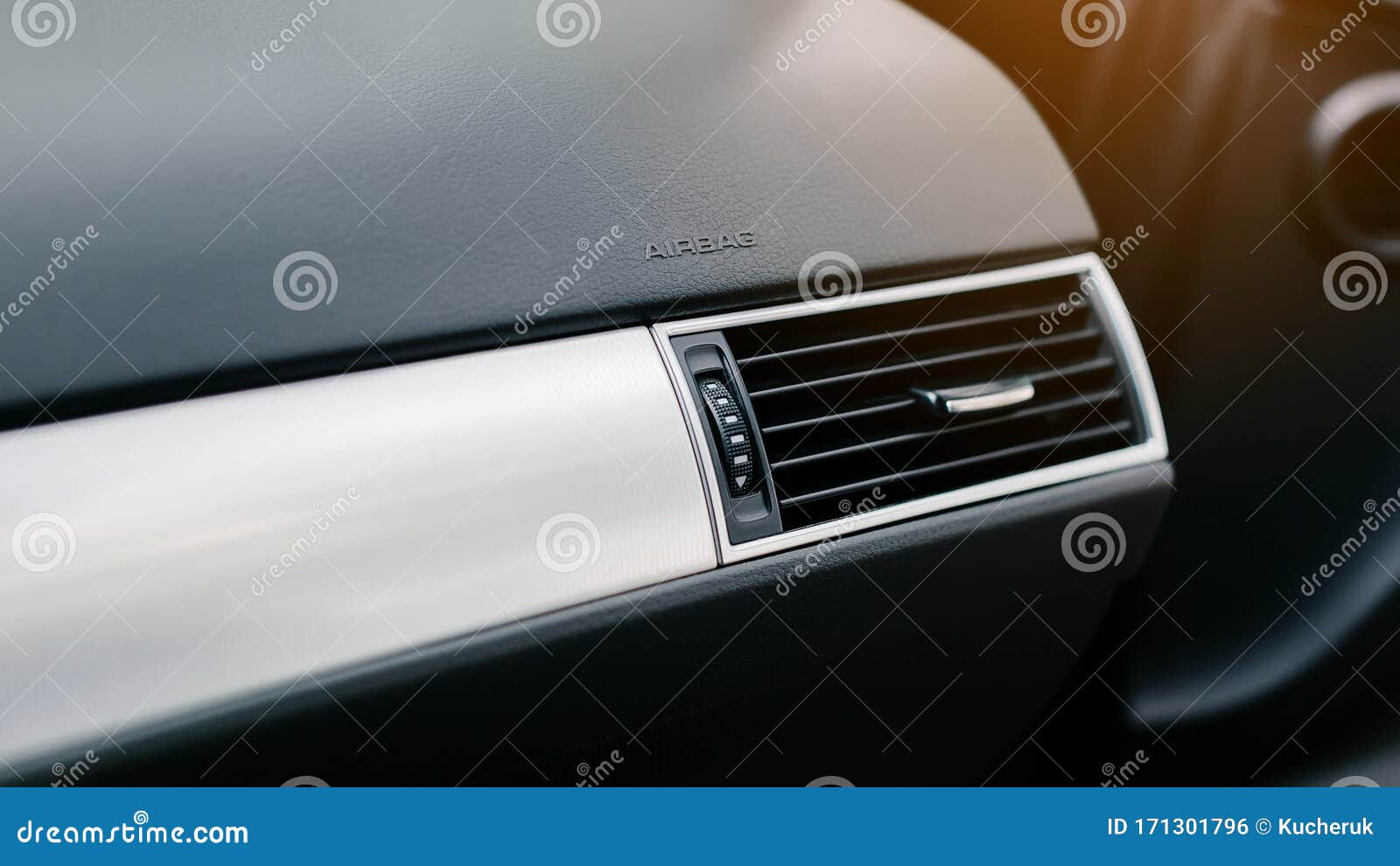 CloseUp of Air Vent in Car. Airbag Icon on the Car Panel. Stock Photo