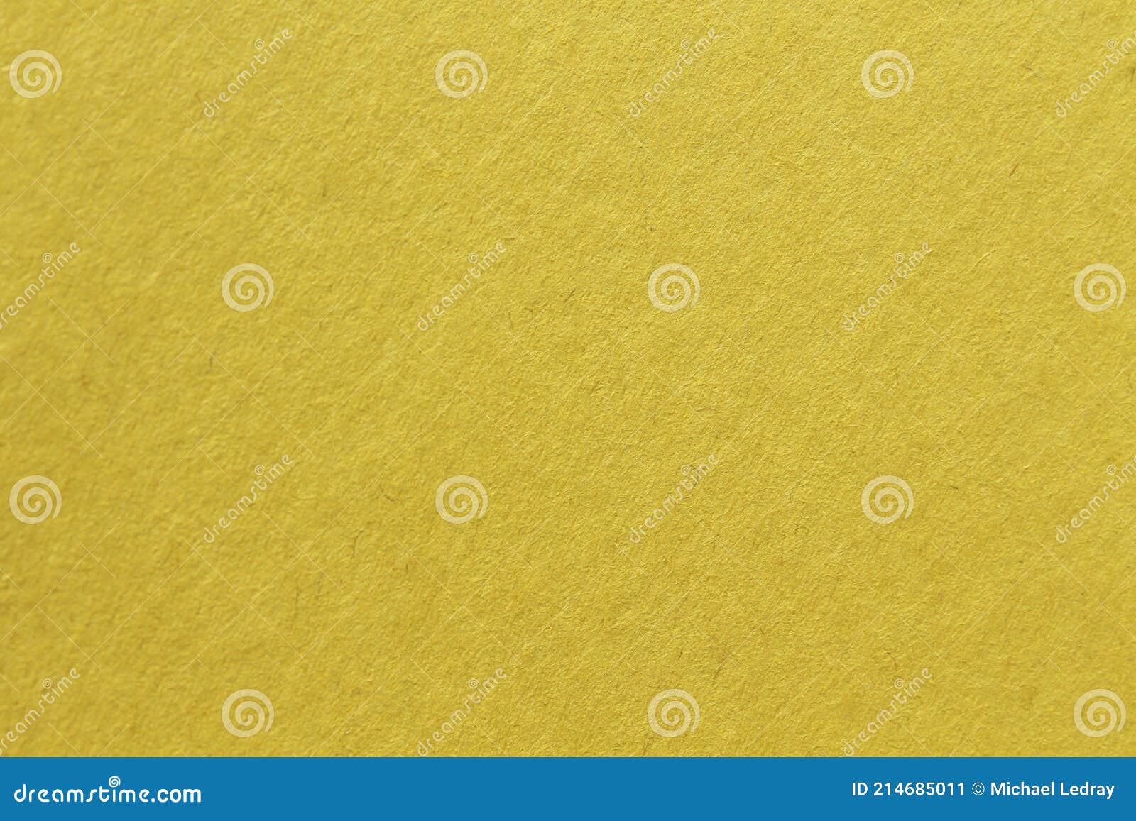 close up aka macro shot of yellow construction paper, showing texture, paper fibers, flaws, and more. the perfect image for all