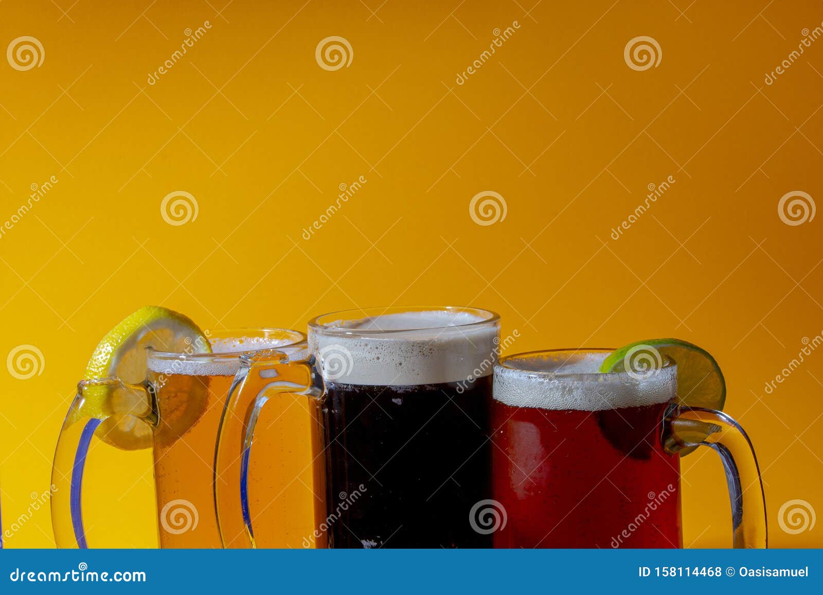 Close Up of Ale, Lager and Stout Beer Mugs on a Orange Background and a