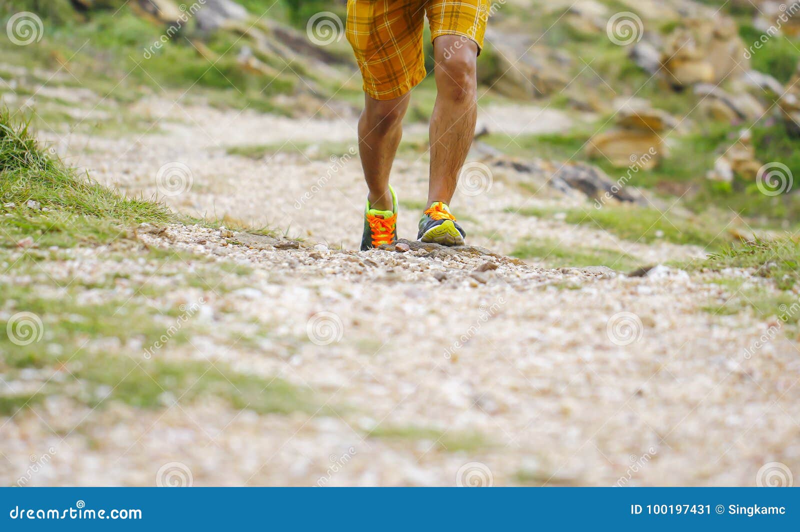 close up of an athlete`s feet wearing sports shoes on a challeng