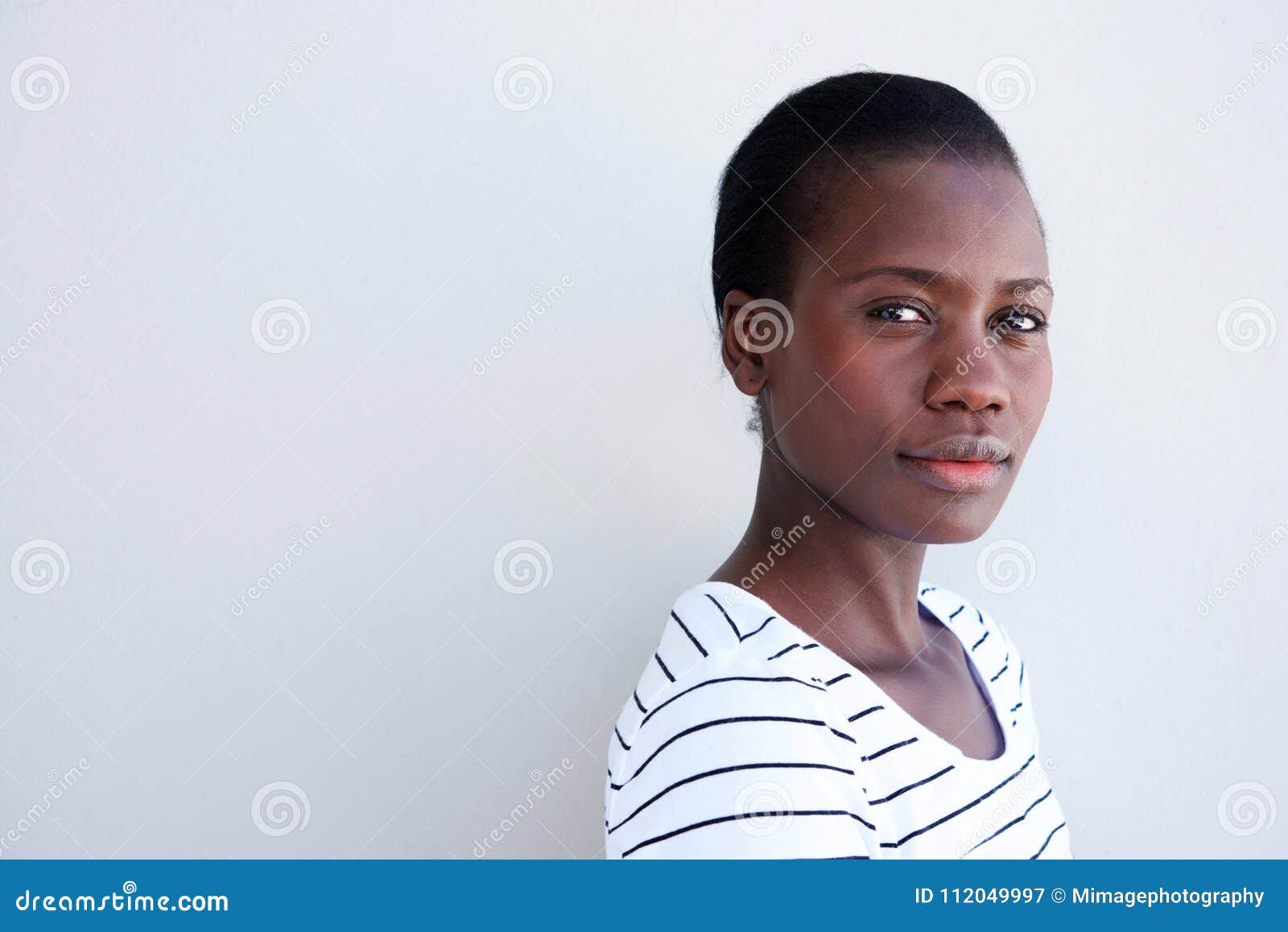 close up attractive young black woman with serious expression