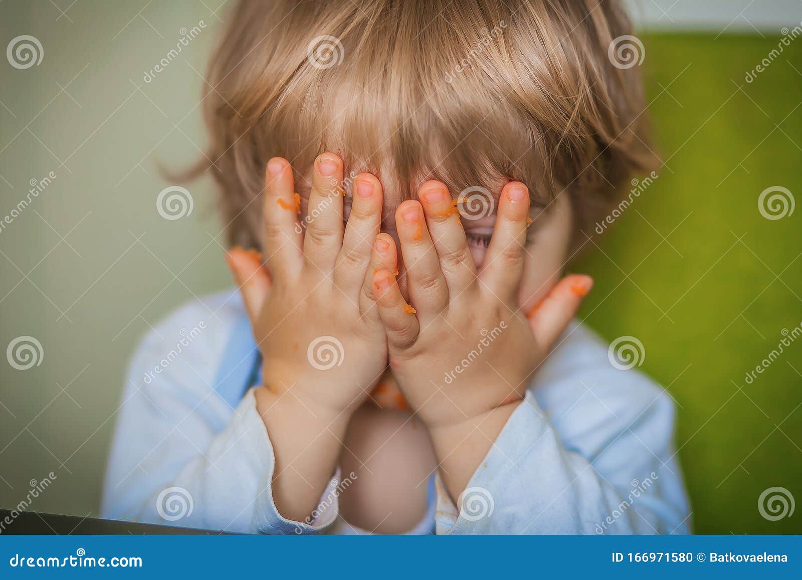 Close Up of the Baby while Eating with His Bare Hands Stock Photo Image of boys, education