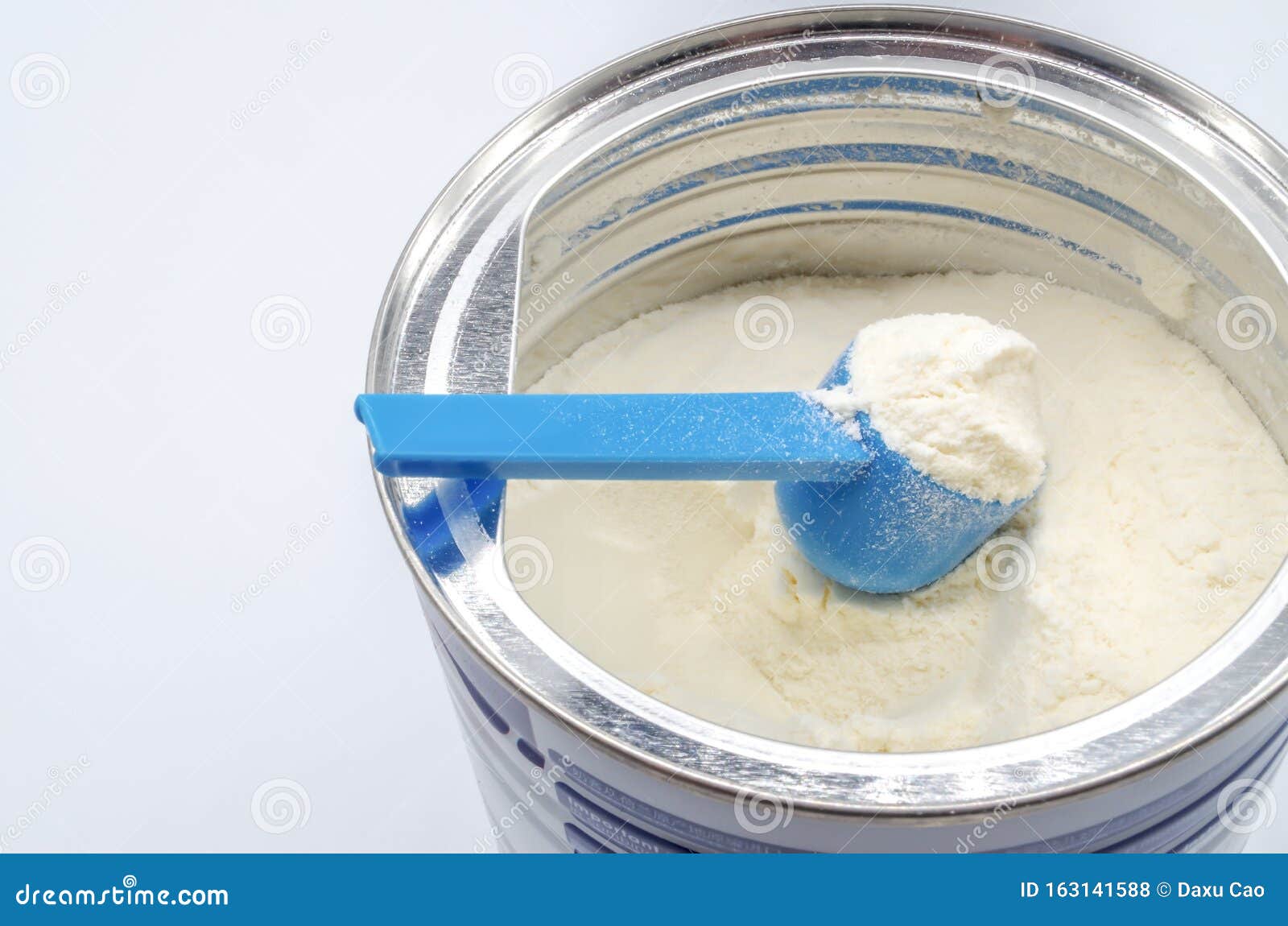 powdered milk with spoon for baby