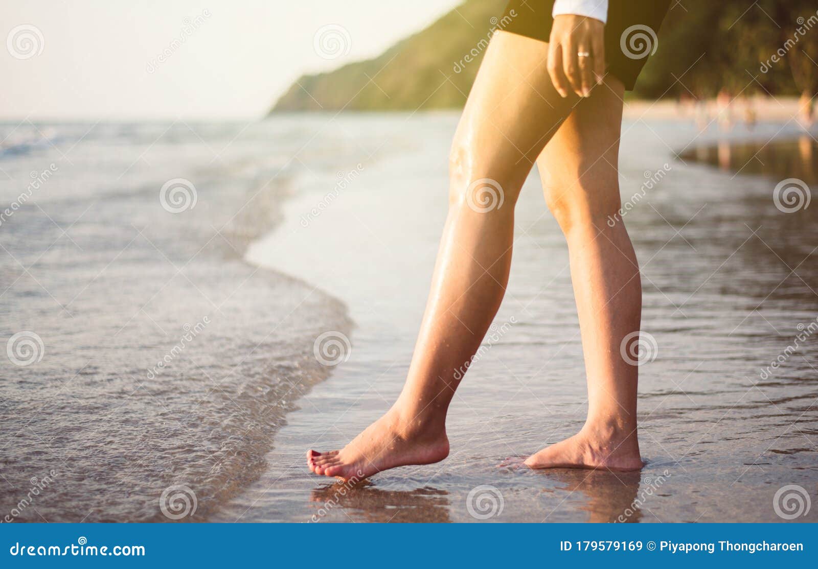Woman Barefoot Walking On Summer Along Wave Of Sea Water 