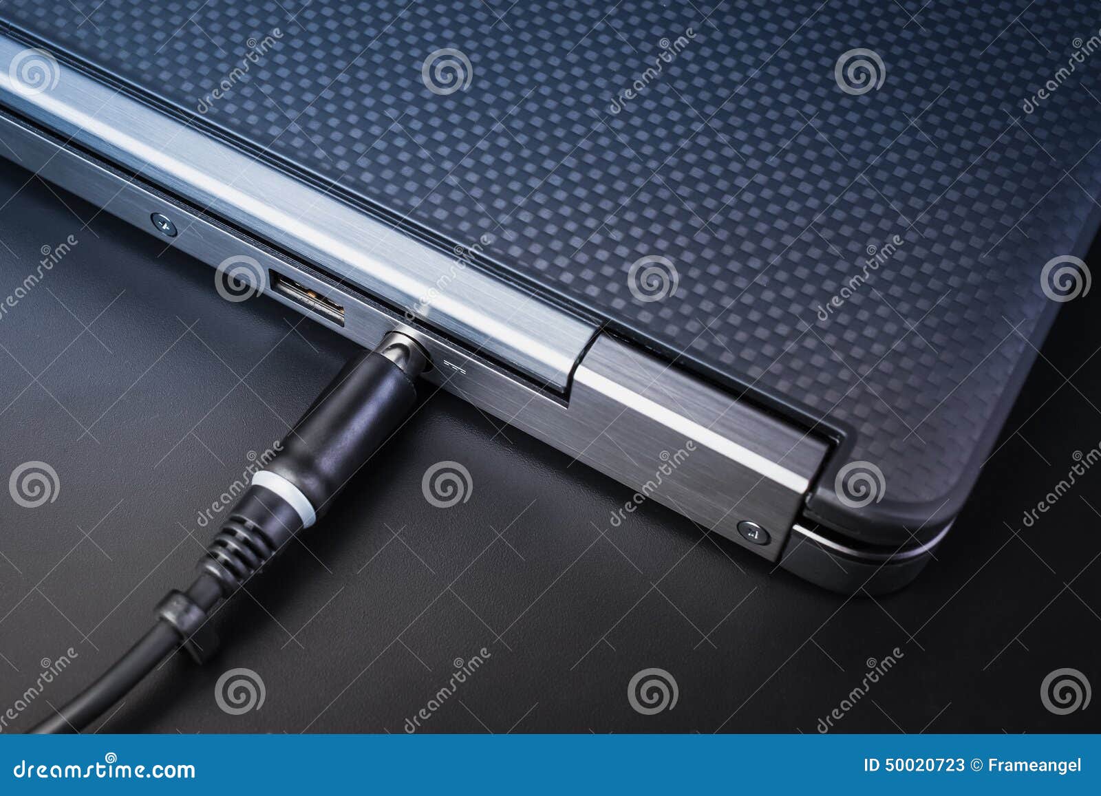 Close Up Of Battery Charge On Laptop Computer With Power Plug Stock
