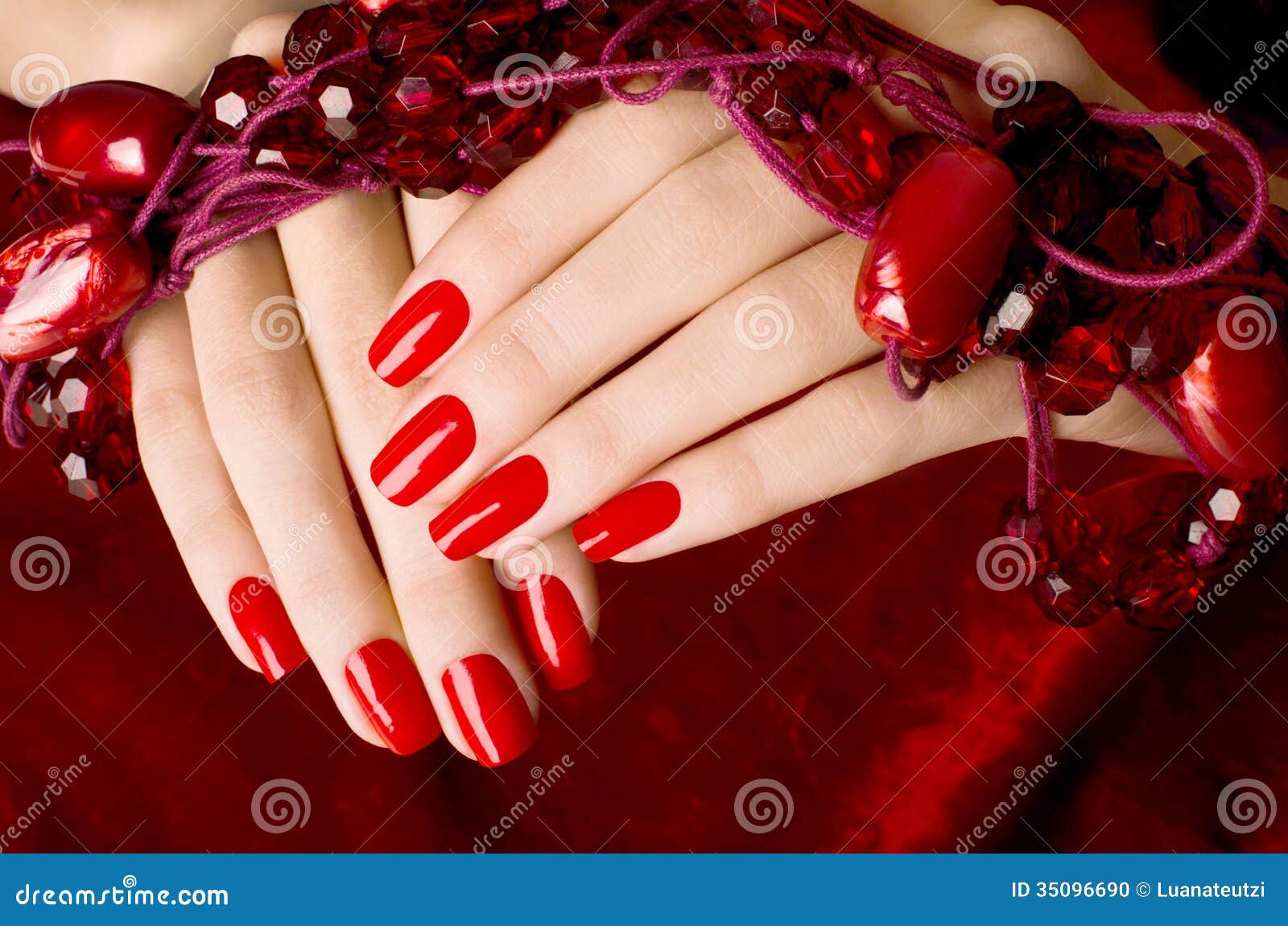 Womans Hand with Red Nails · Free Stock Photo