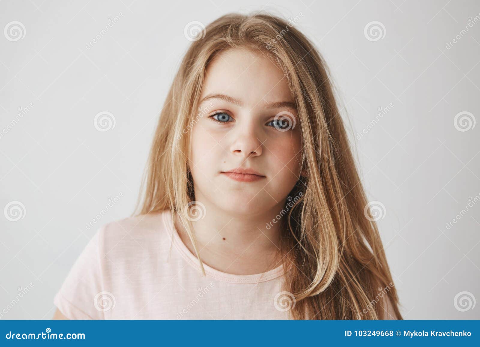 Close Up Of Beautiful Little Blonde Girl With Light Long Hair And