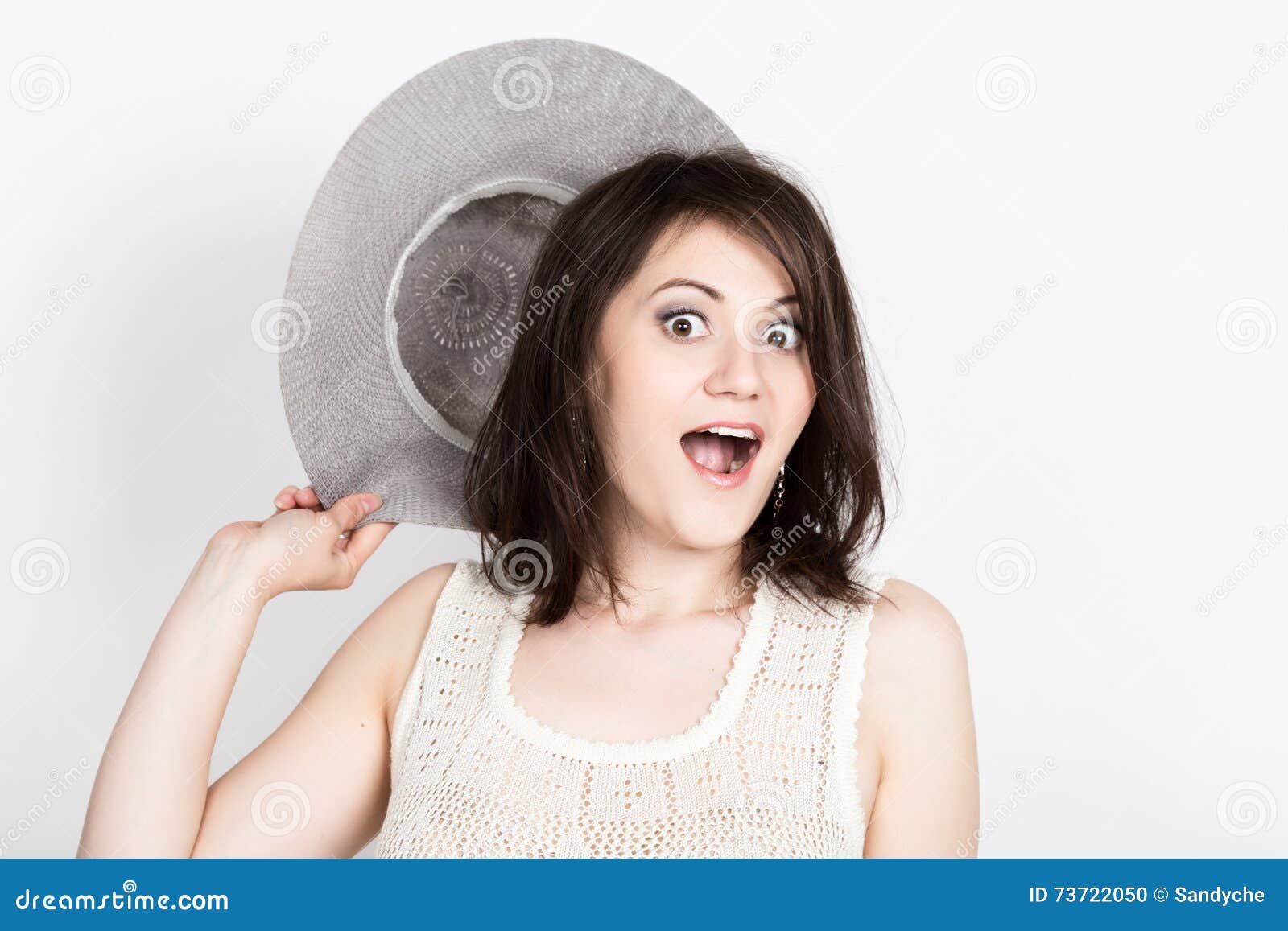 Close-up of Beautiful Young Brunette Woman Holding a Broad-brimmed Hat ...