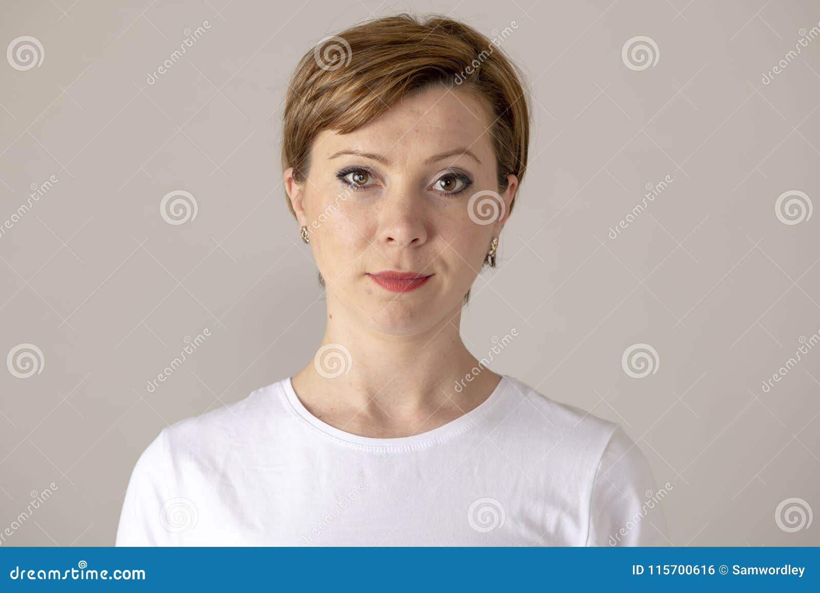 Minimal waist up portrait of smiling mature woman wearing neutral