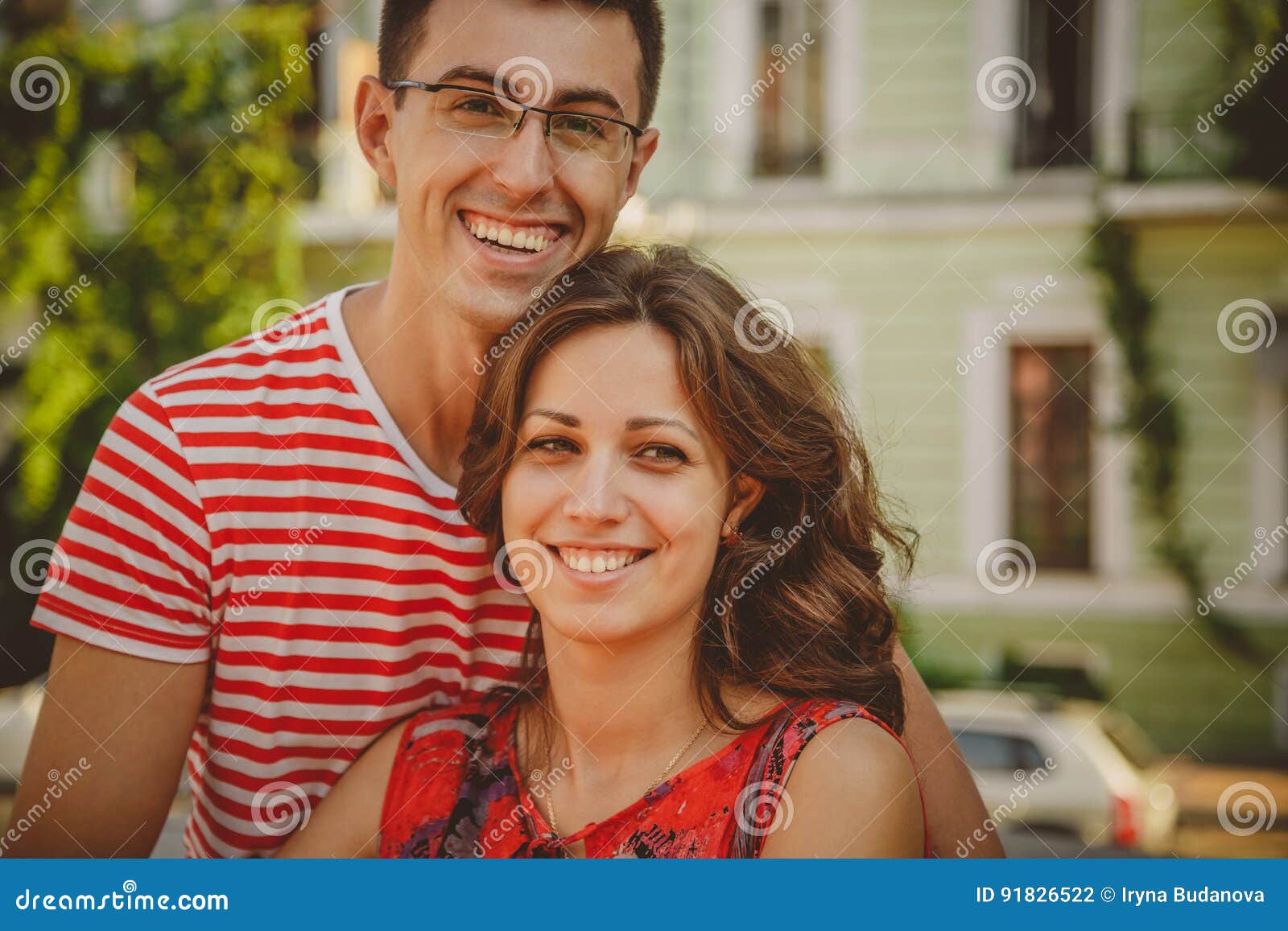 Close Up Of Beautiful Young Smiling Couple In Love Hugging Standing