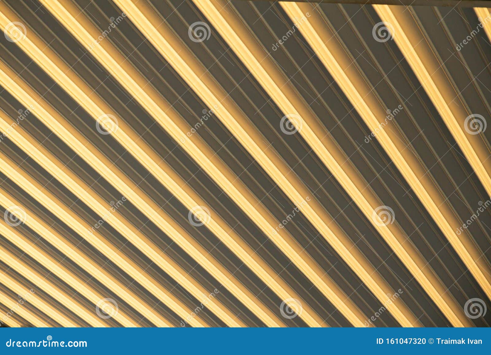 close-up of beige-yellow corrugated surface, eliciting optical illusion