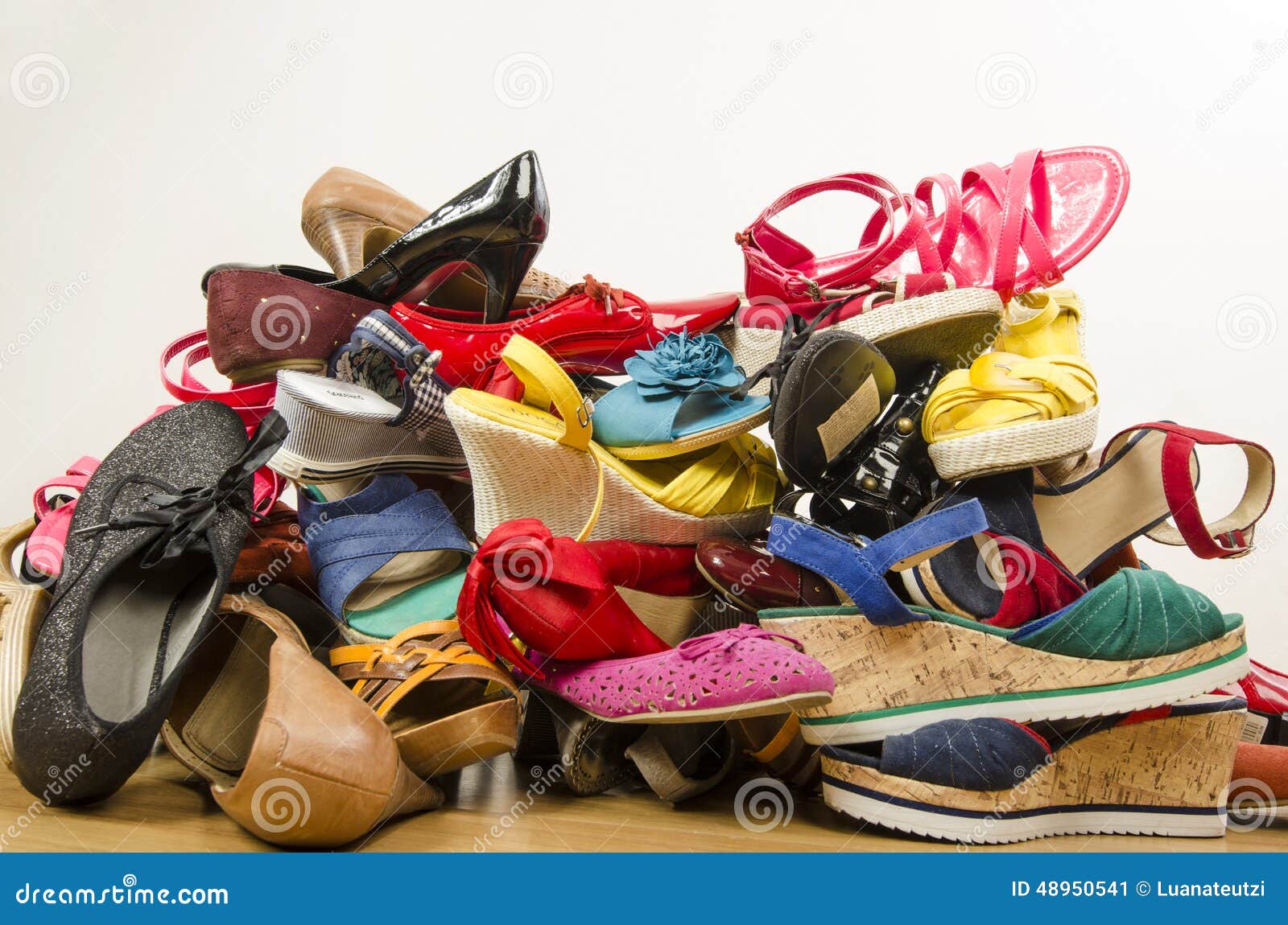 close-up-big-pile-colorful-woman-shoes-untidy-stack-thrown-ground-48950541.jpg