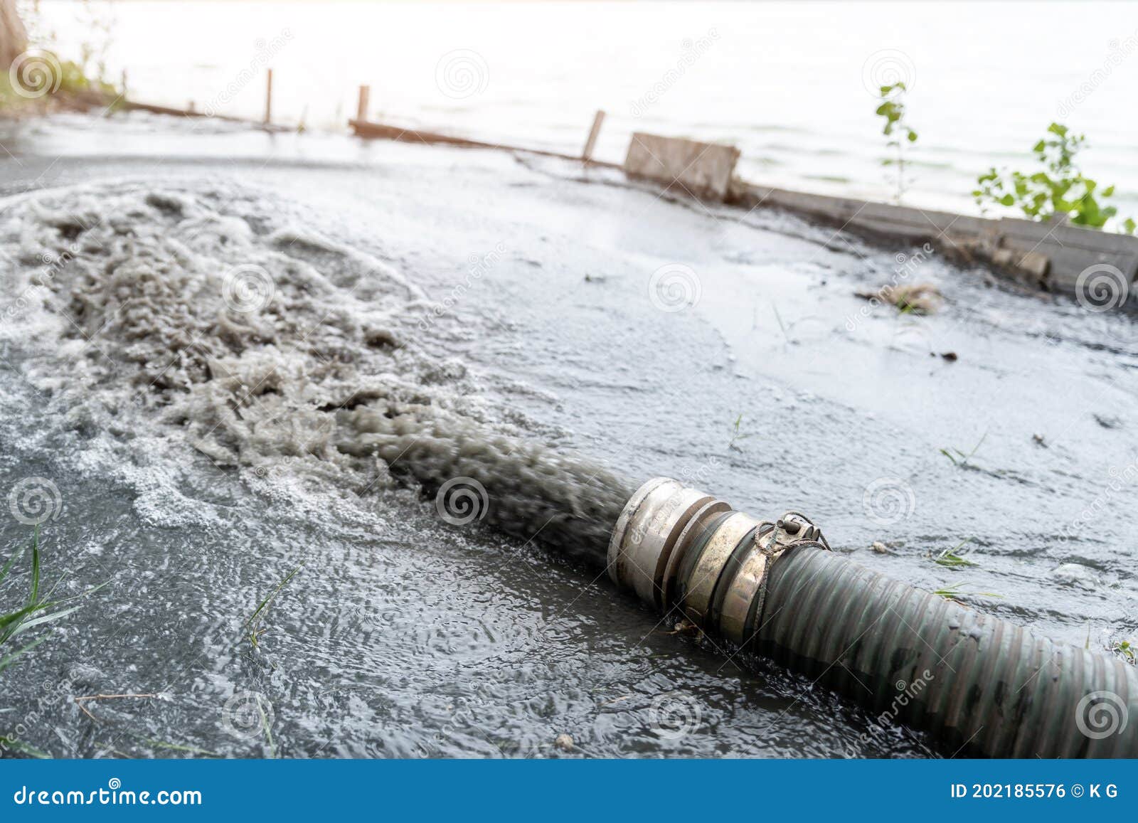 Close-up Big Pipe of Power Pump Machine Pouring Mud Sludge Waste Water ...