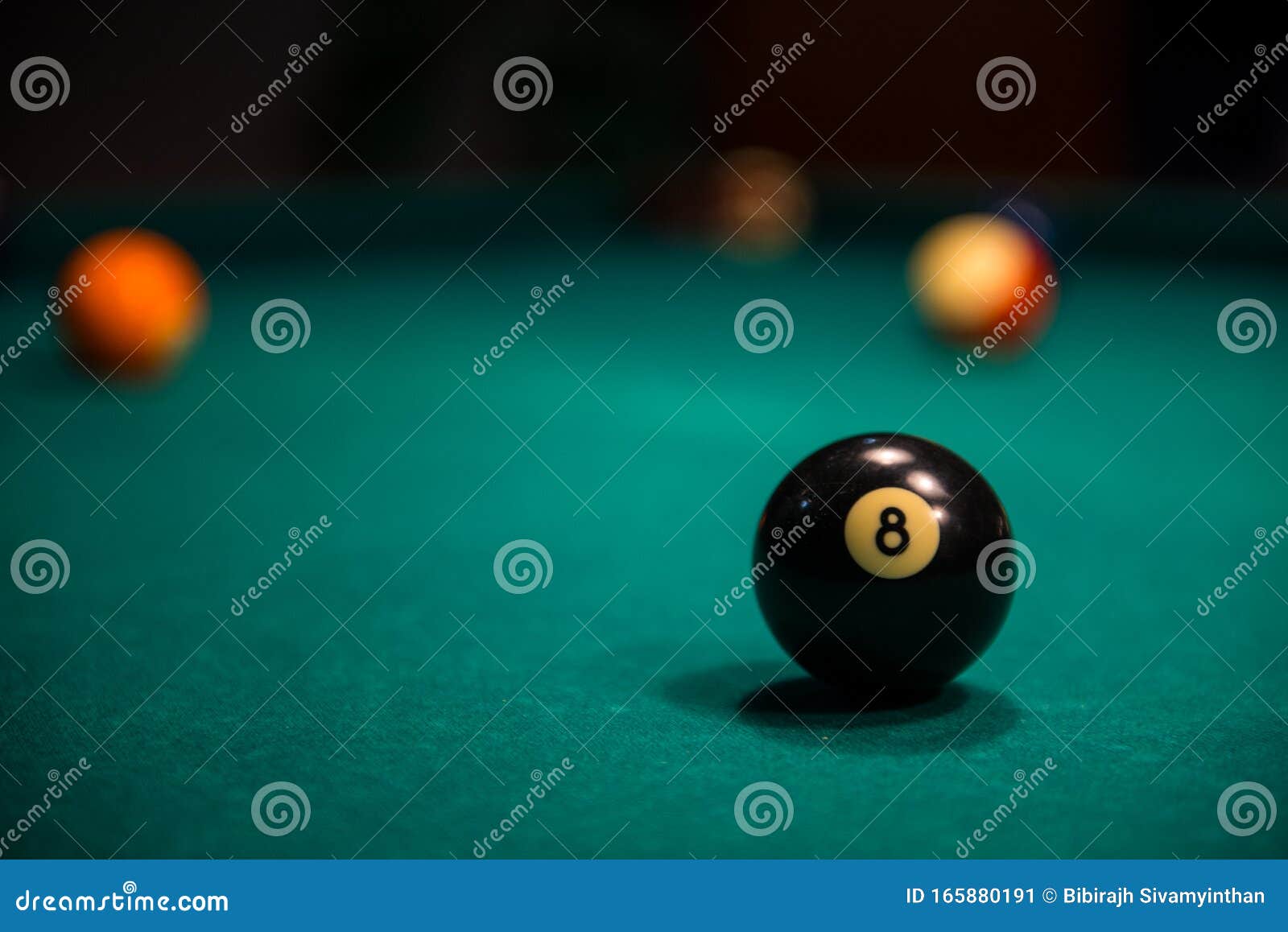 Close up Of Billiard 8 Ball On Billiard Table With Other Balls In The